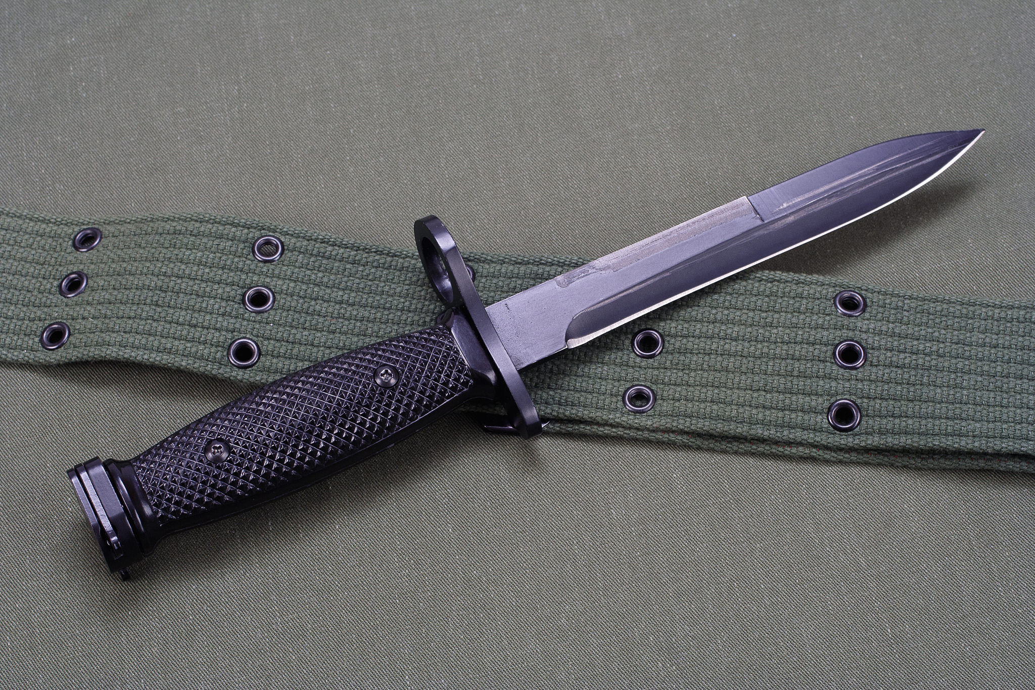 m16 rifle bayonet on uniform background