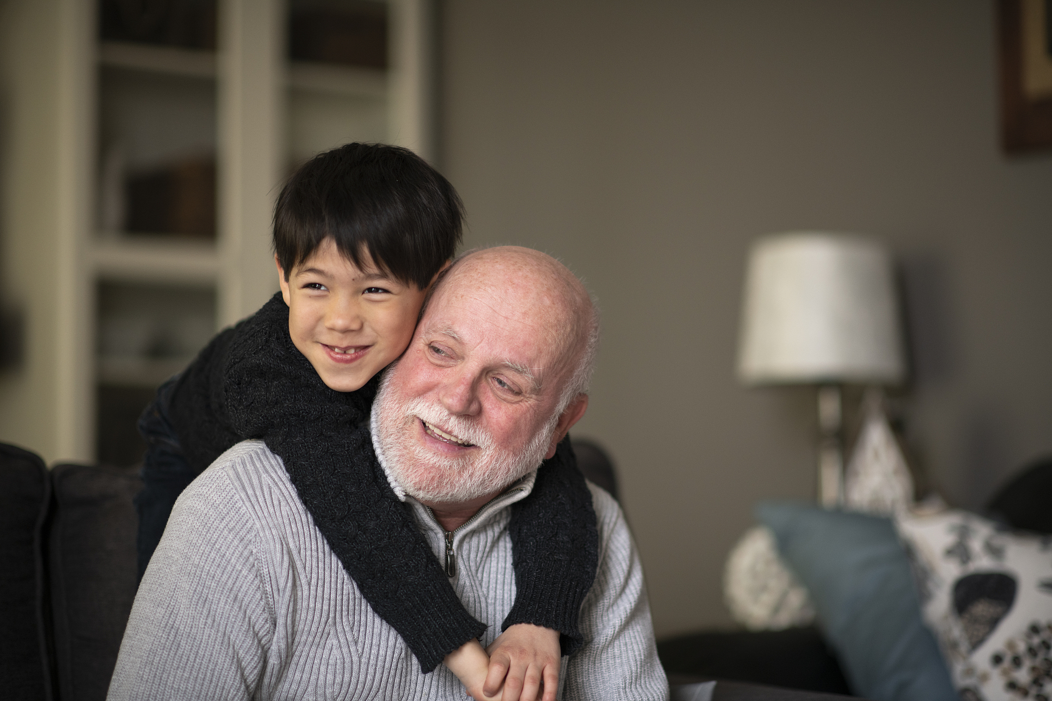 grandfather and grandson snuggling