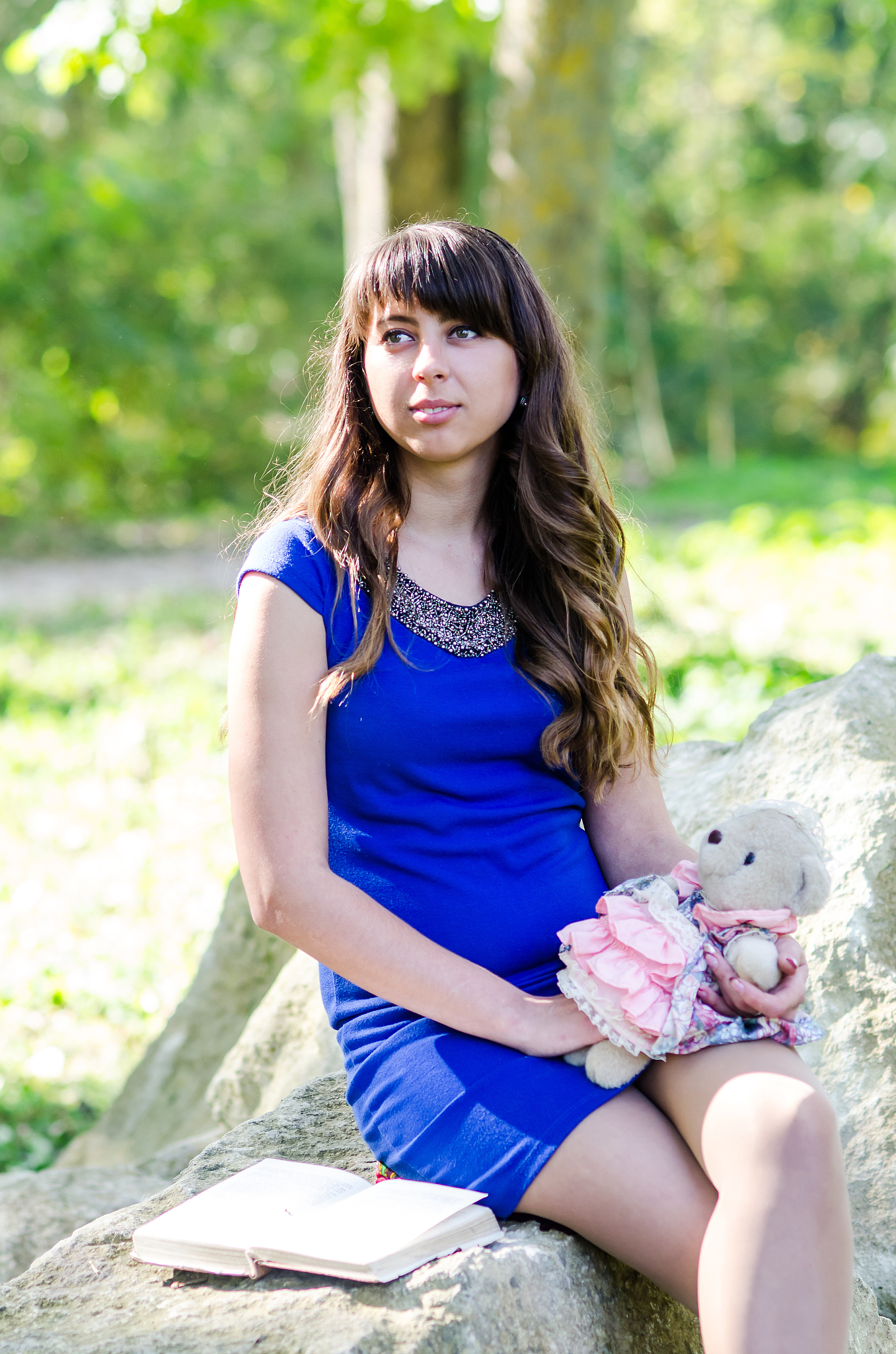 portrait woman with soft toy at summer park