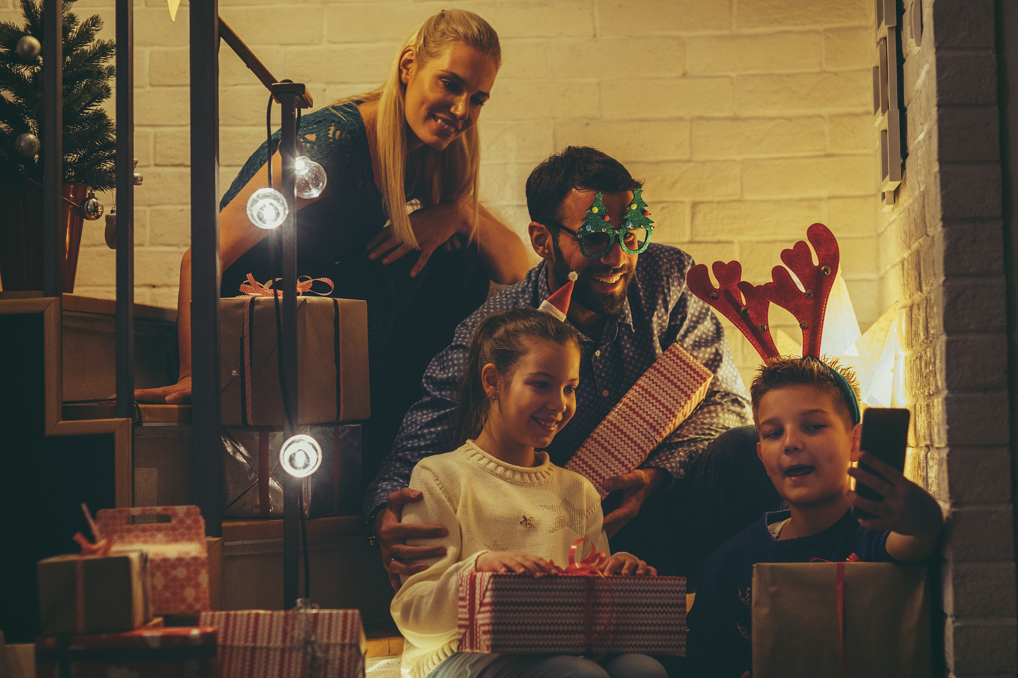 family with christmas gifts
