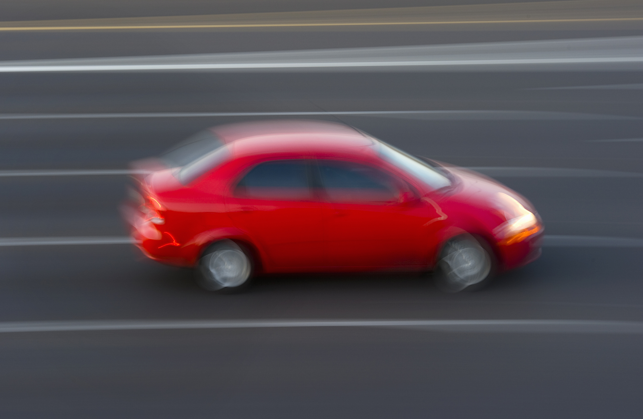 economy car on highway, blurred motion