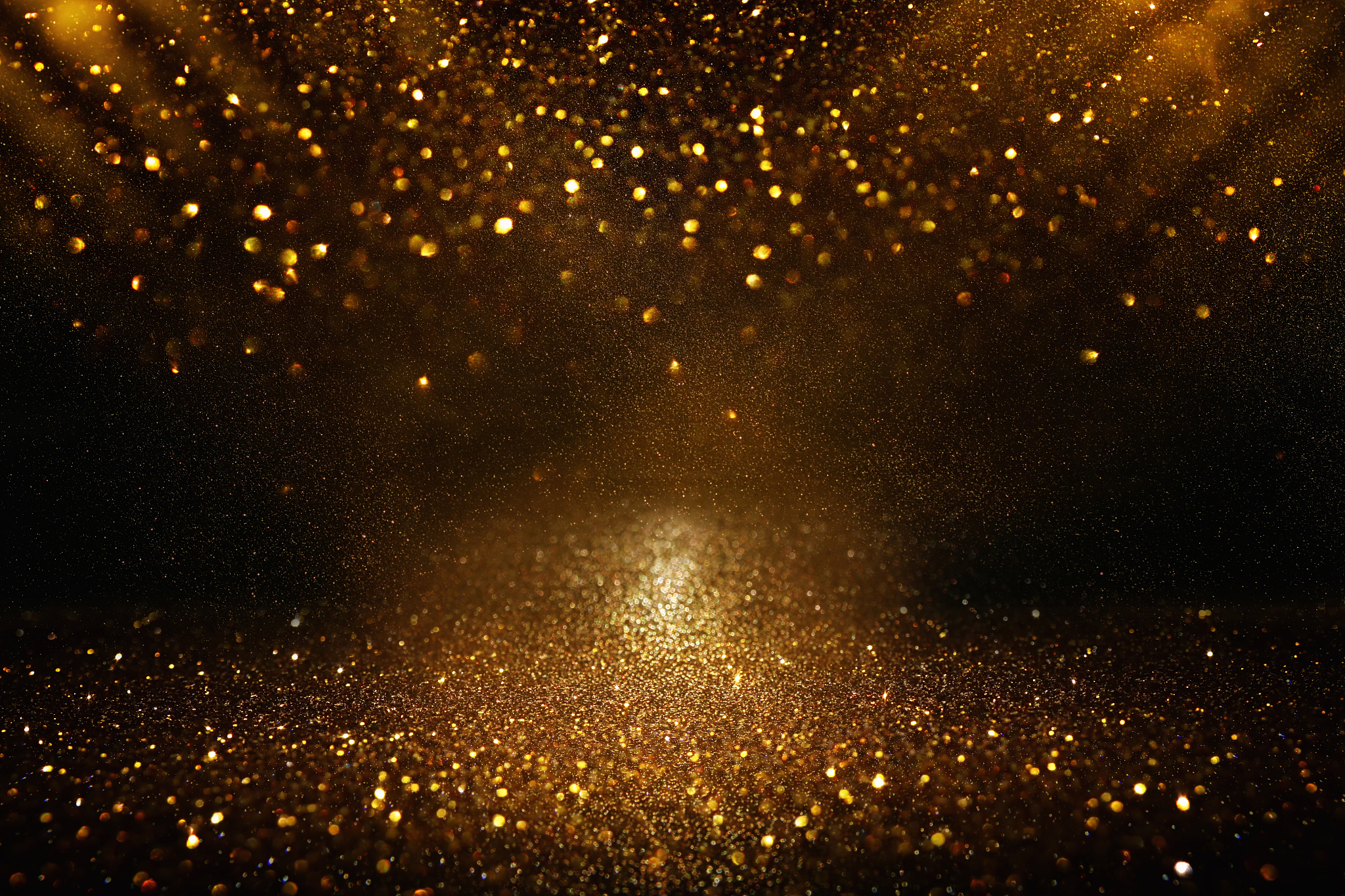 glitter vintage lights background. black and gold. de-focused