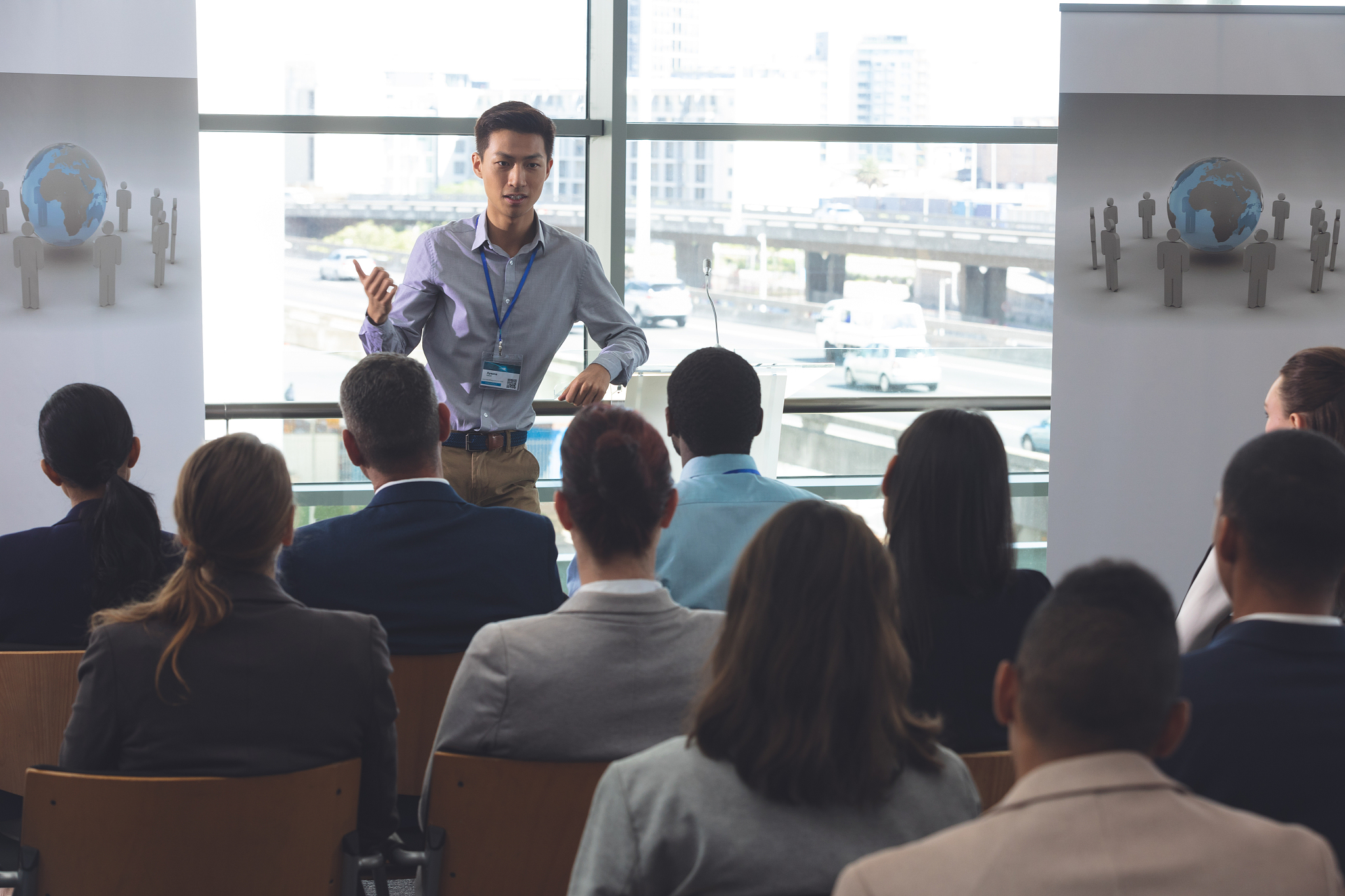 young male professionals speaks at a business seminar