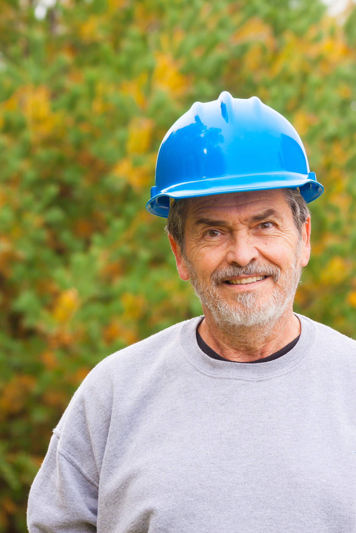 contractor builder with blue hardhat