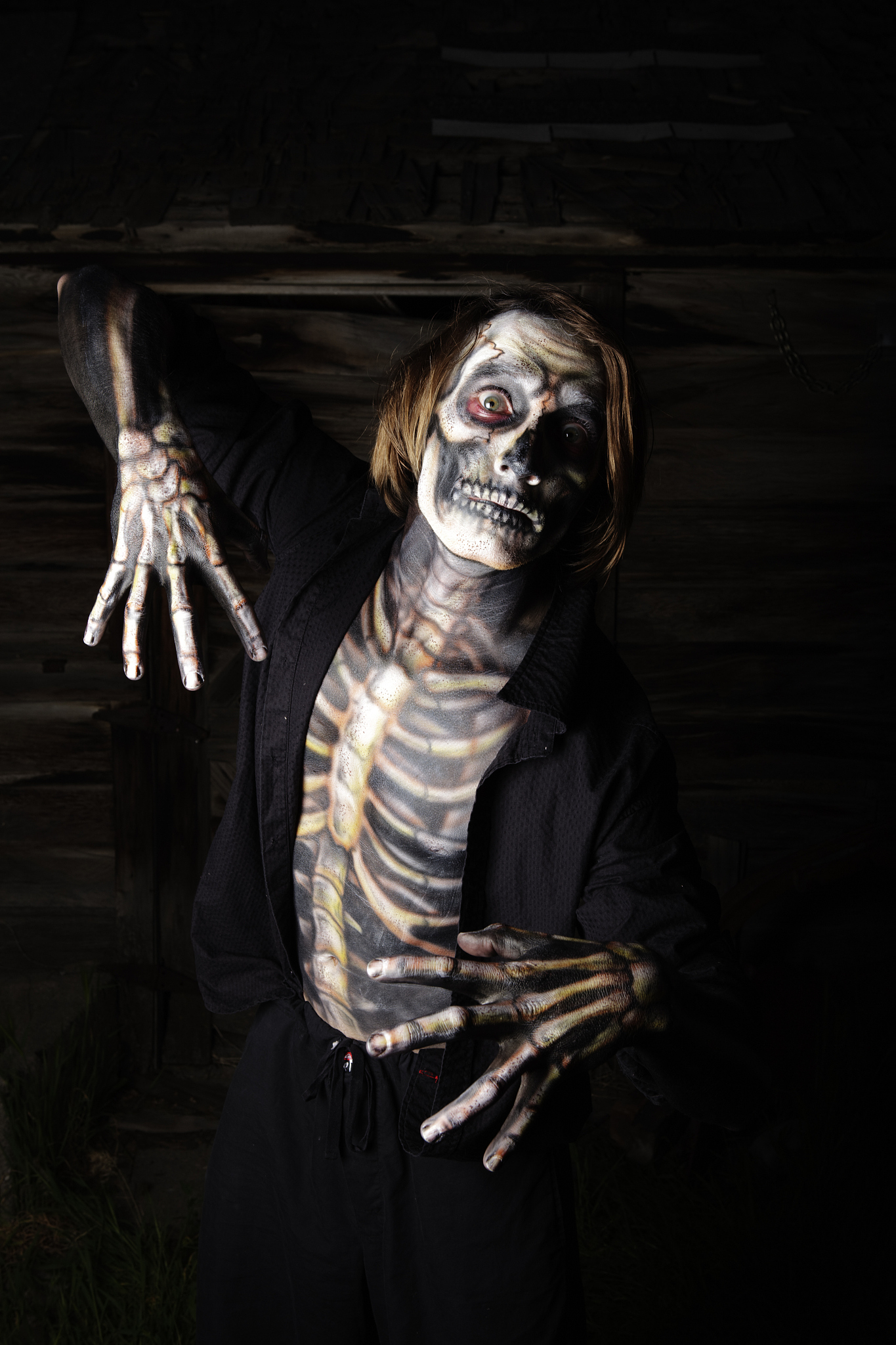 halloween: scary skeleton coming out of the dark