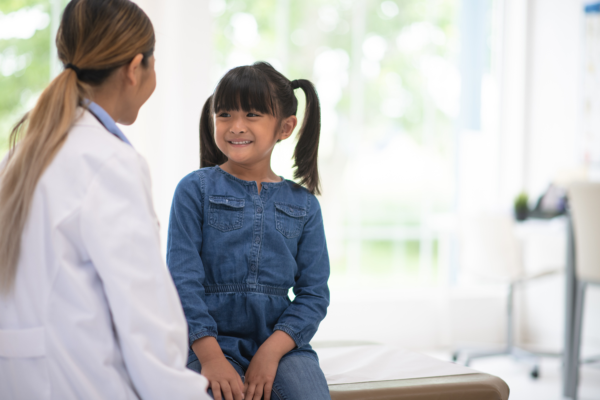 girl getting a check up at the doctor's office