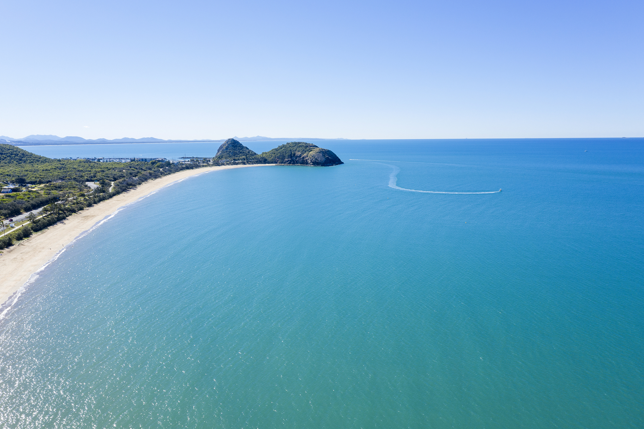 aerial drone views over the blue waters and island outcrops of t