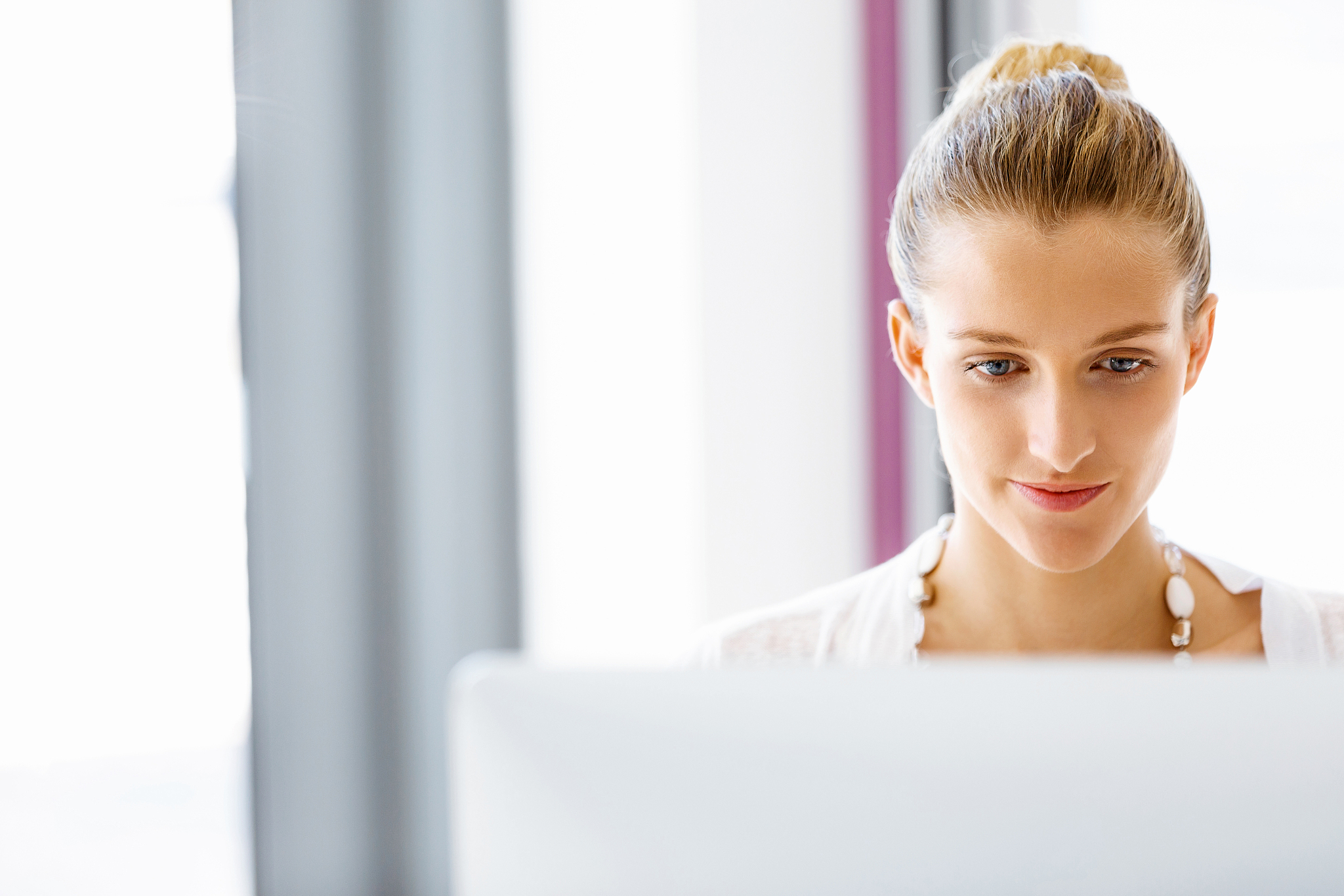attractive office worker sitting at desk. attractive woman sitti