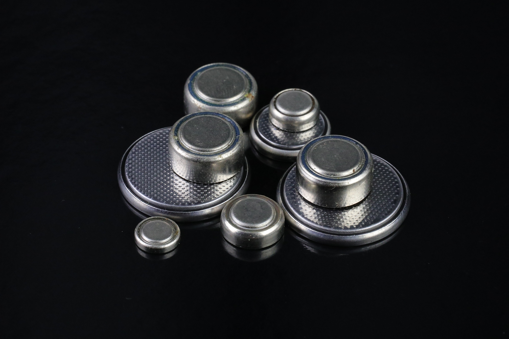 button cell batteries on a black background