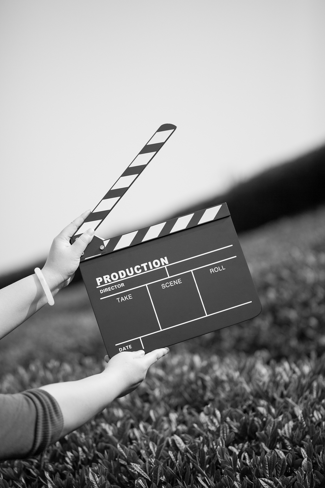 hands holding a movie clapboard
