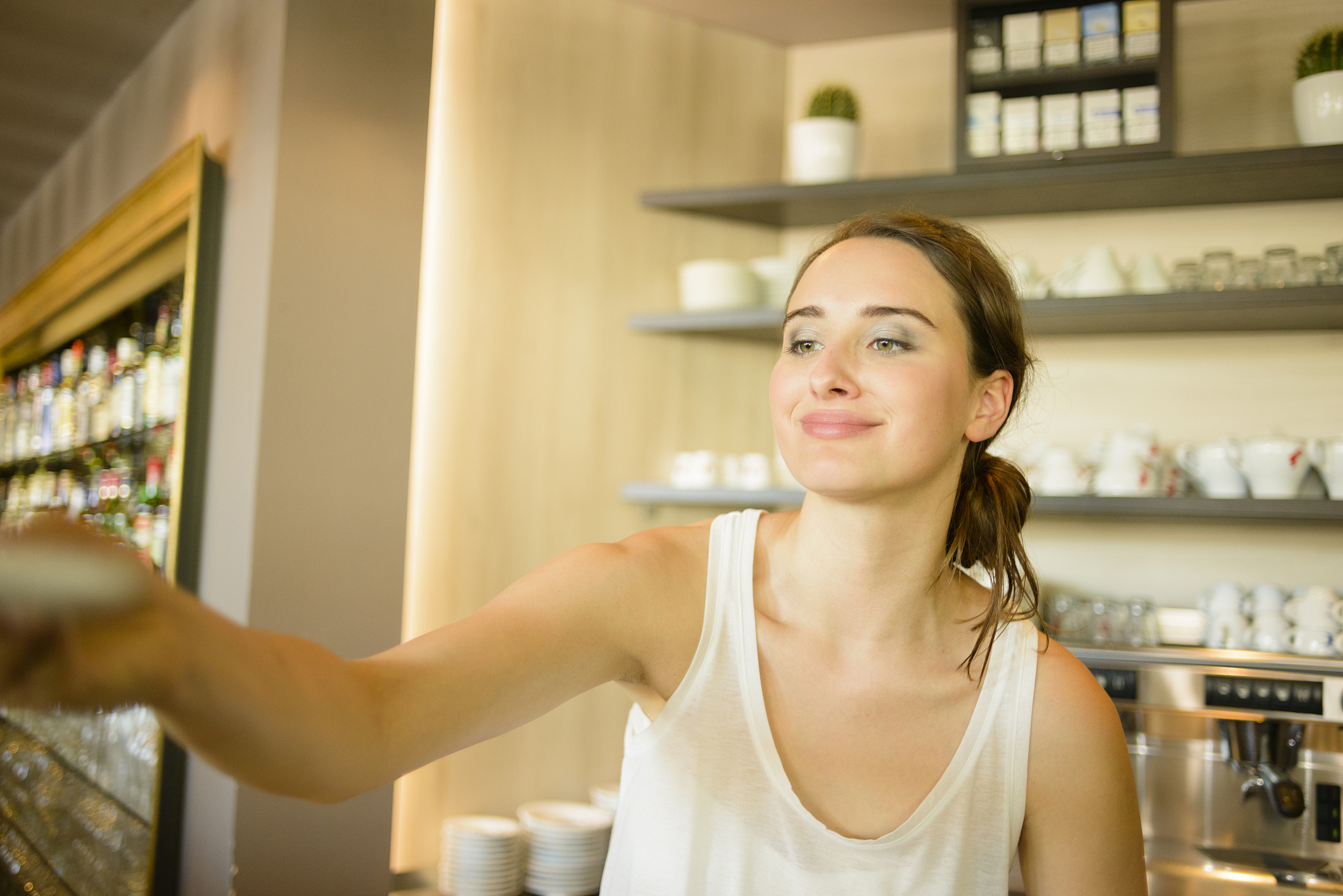 busy female barista enjoying her job