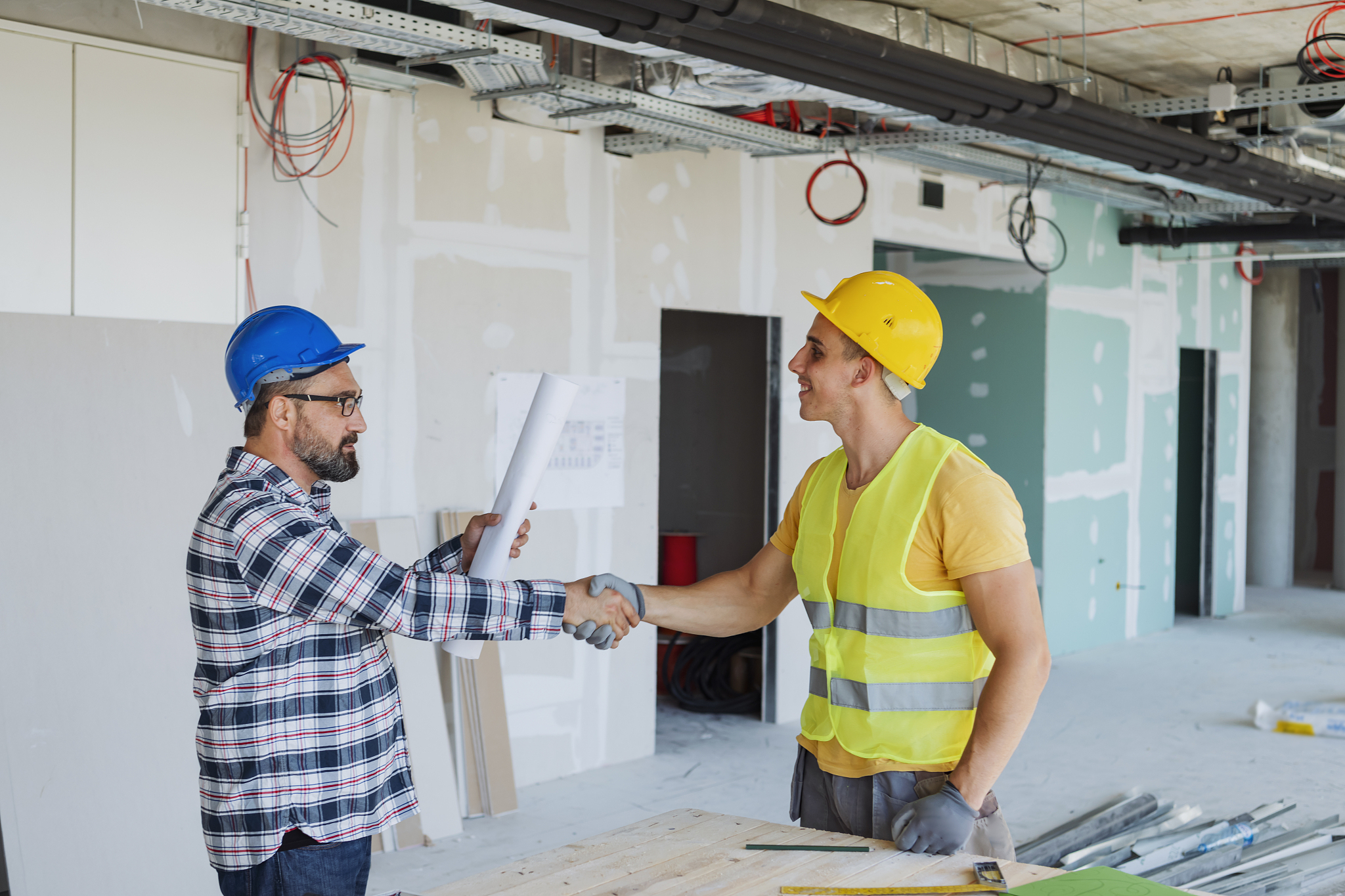 engineer and architect handshake at meeting with successful cons