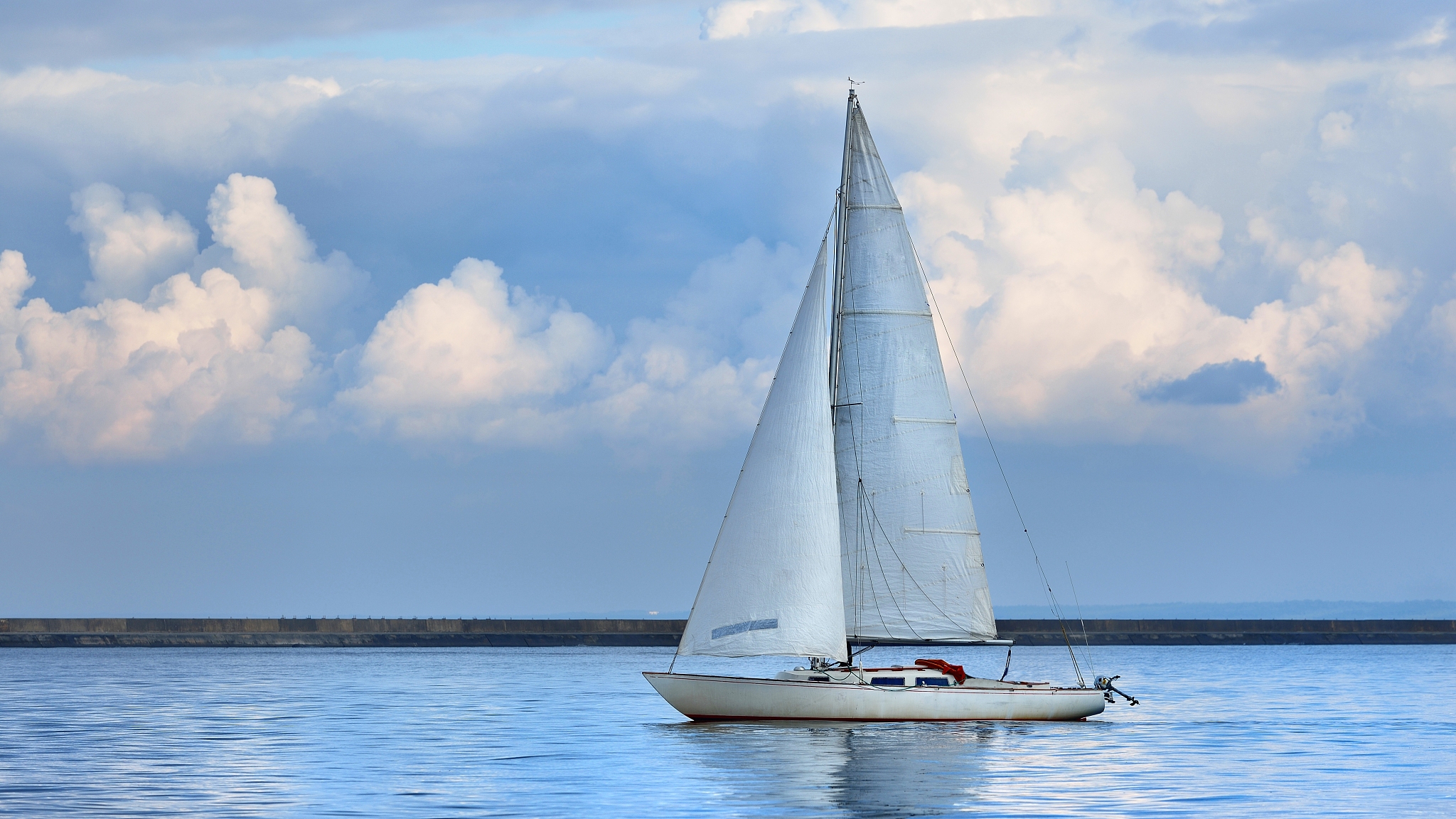 white yacht sails in the baltic sea