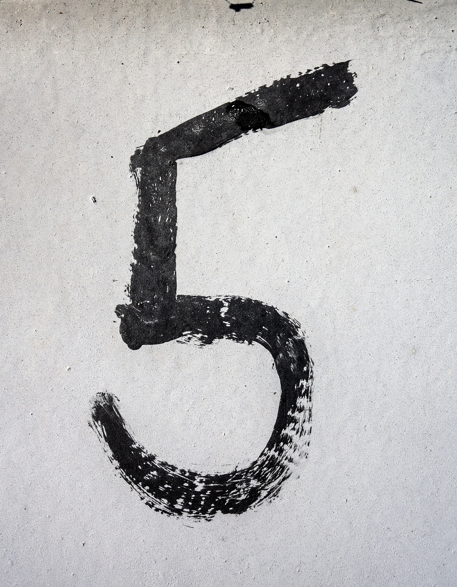 written wording in distressed state typography found number five