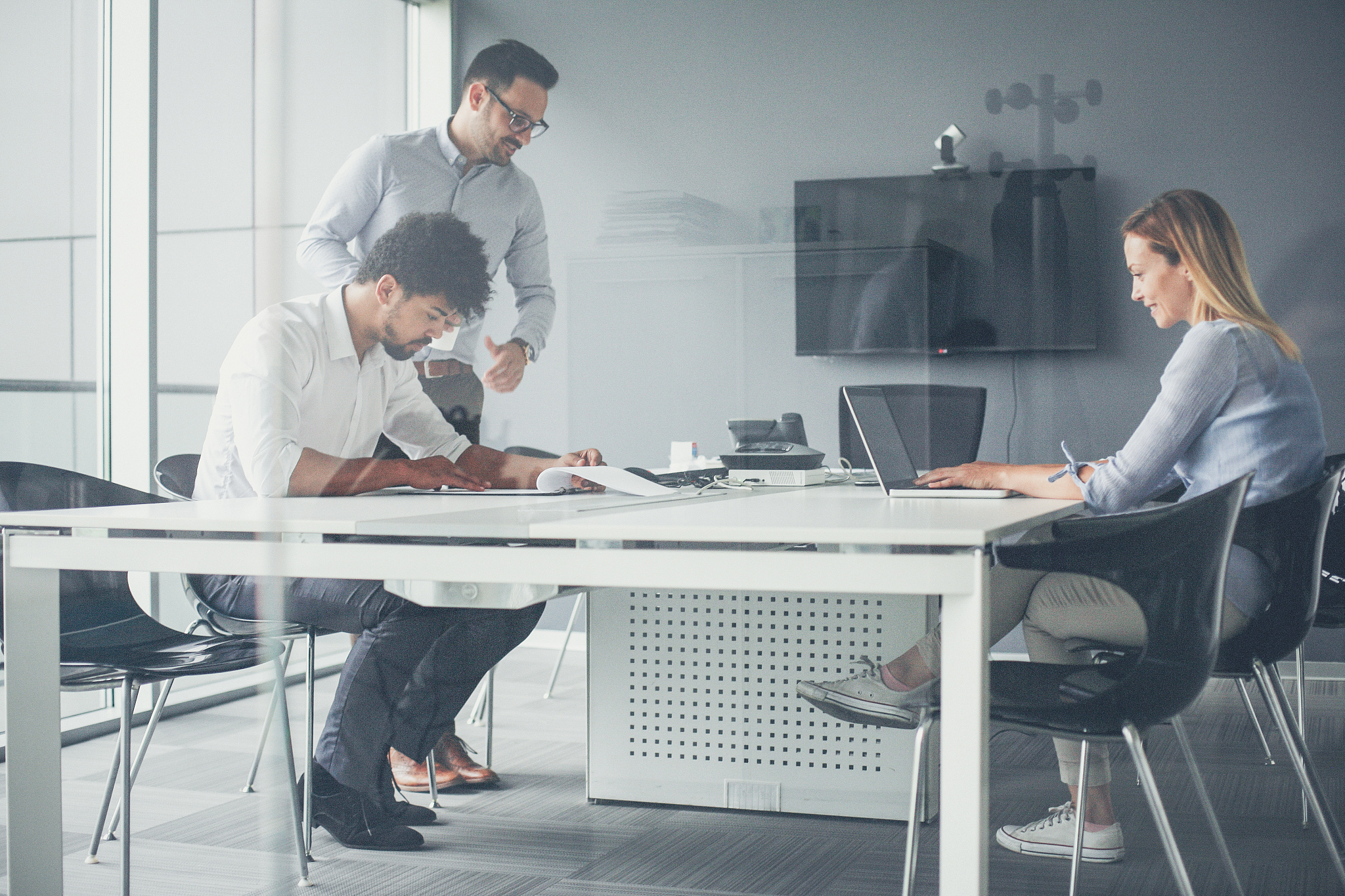 three business people working in office.