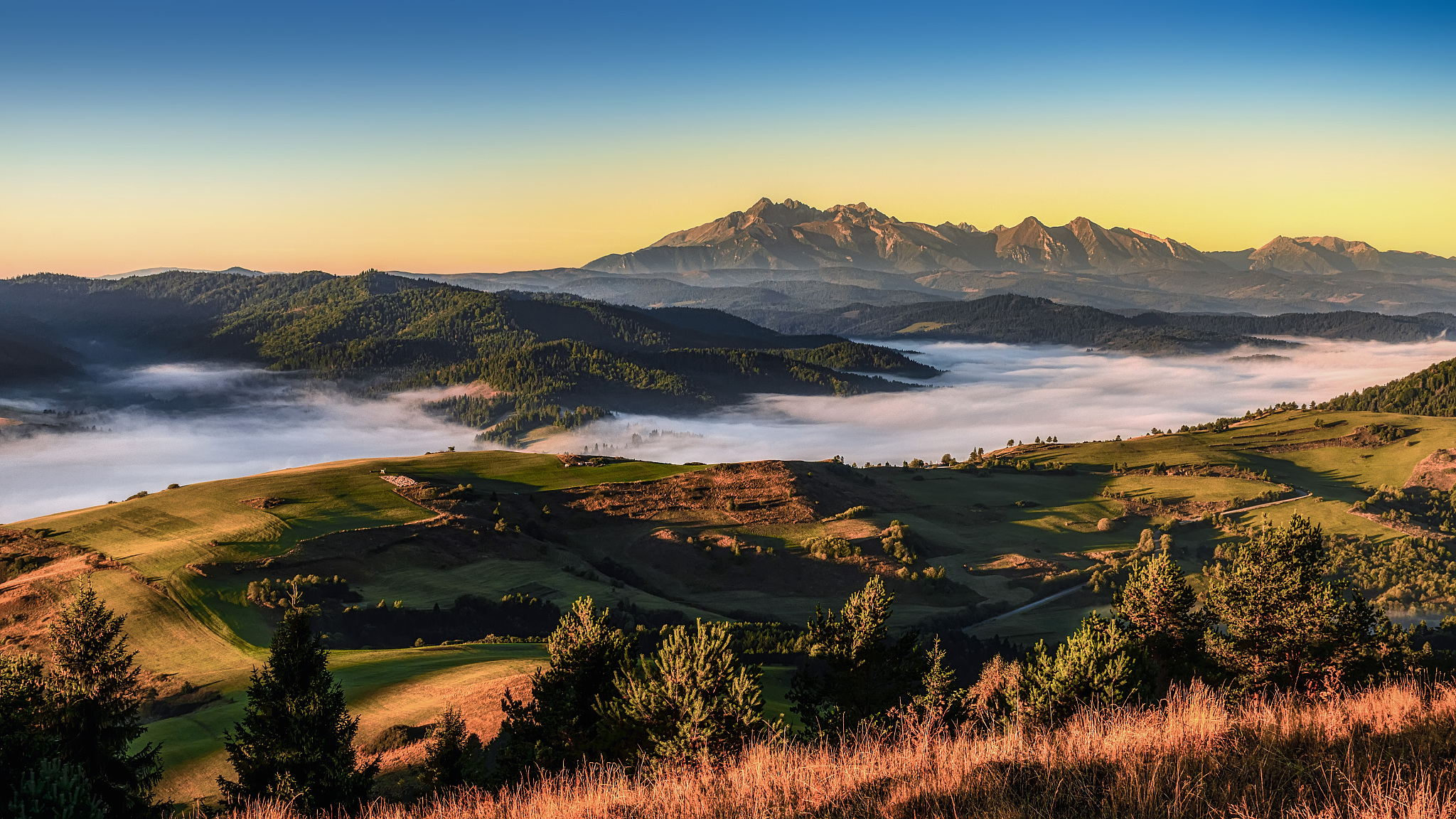 Witnessing a Majestic Sunrise in a Tranquil Valley