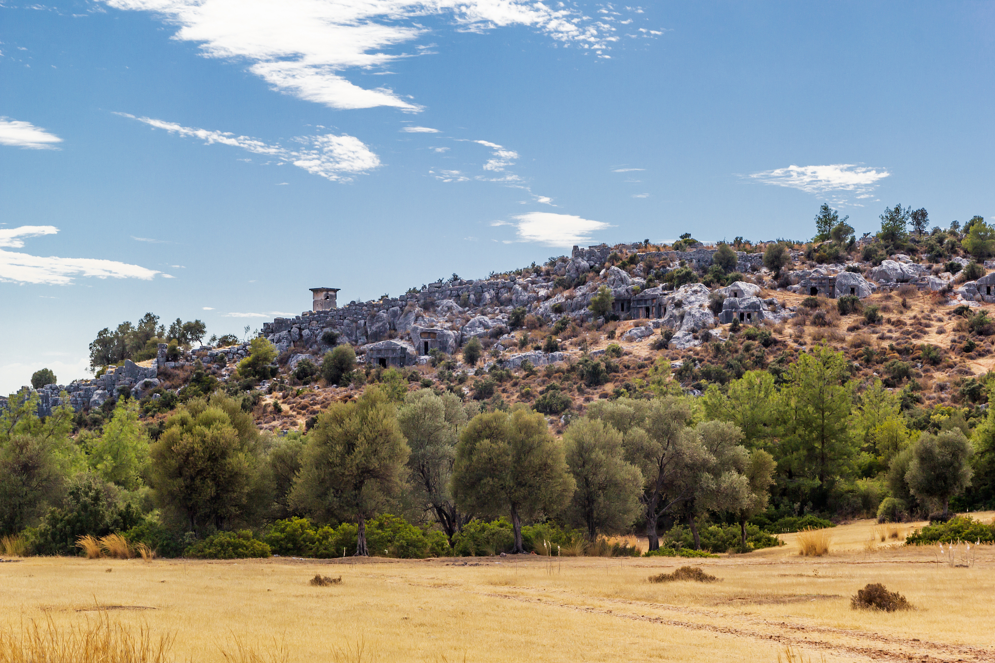 ruins on mountains likya yolu way in turkey, autumn hiking
