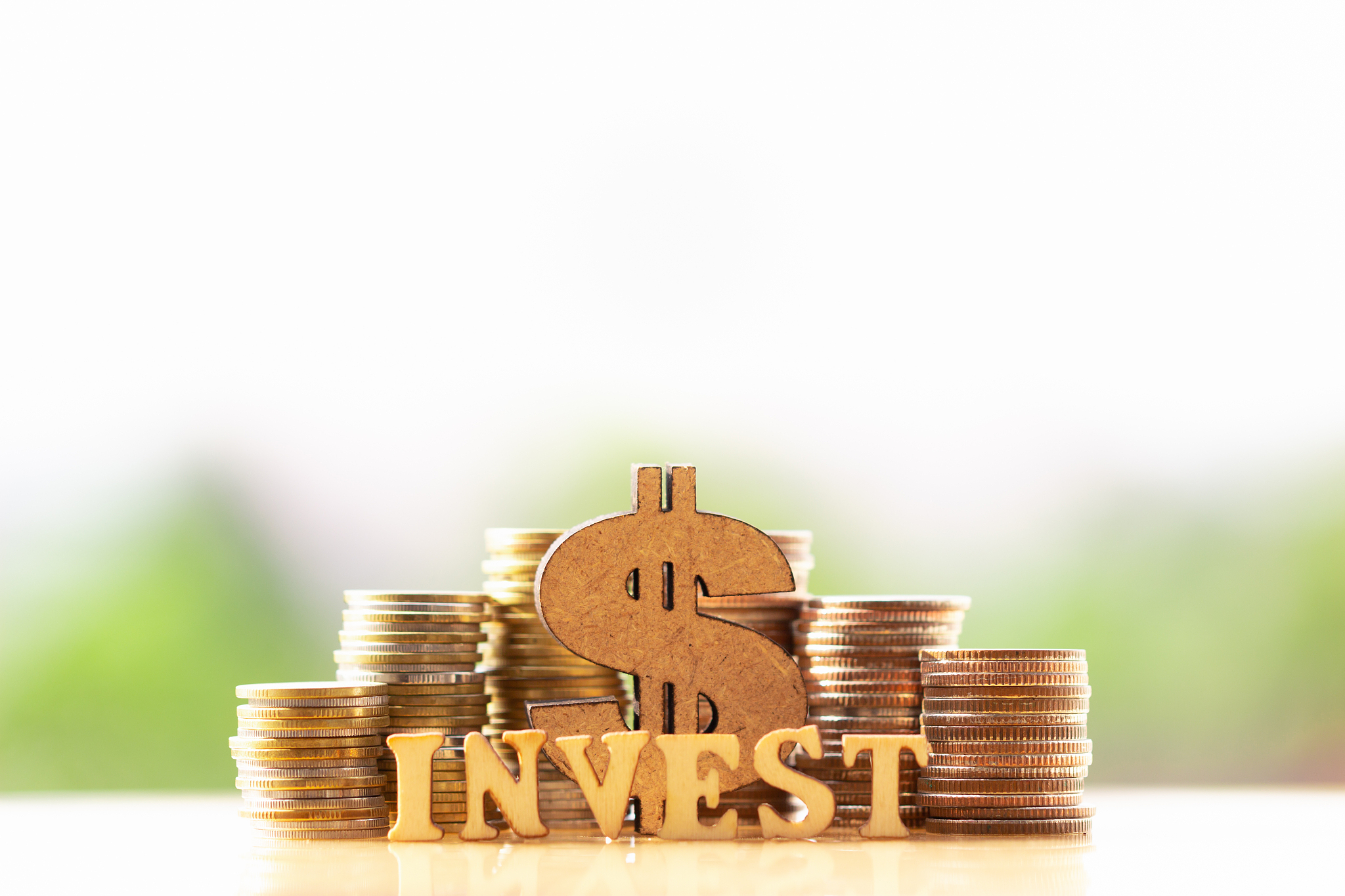 dollar symbol and stack of coins in concept of savings and money