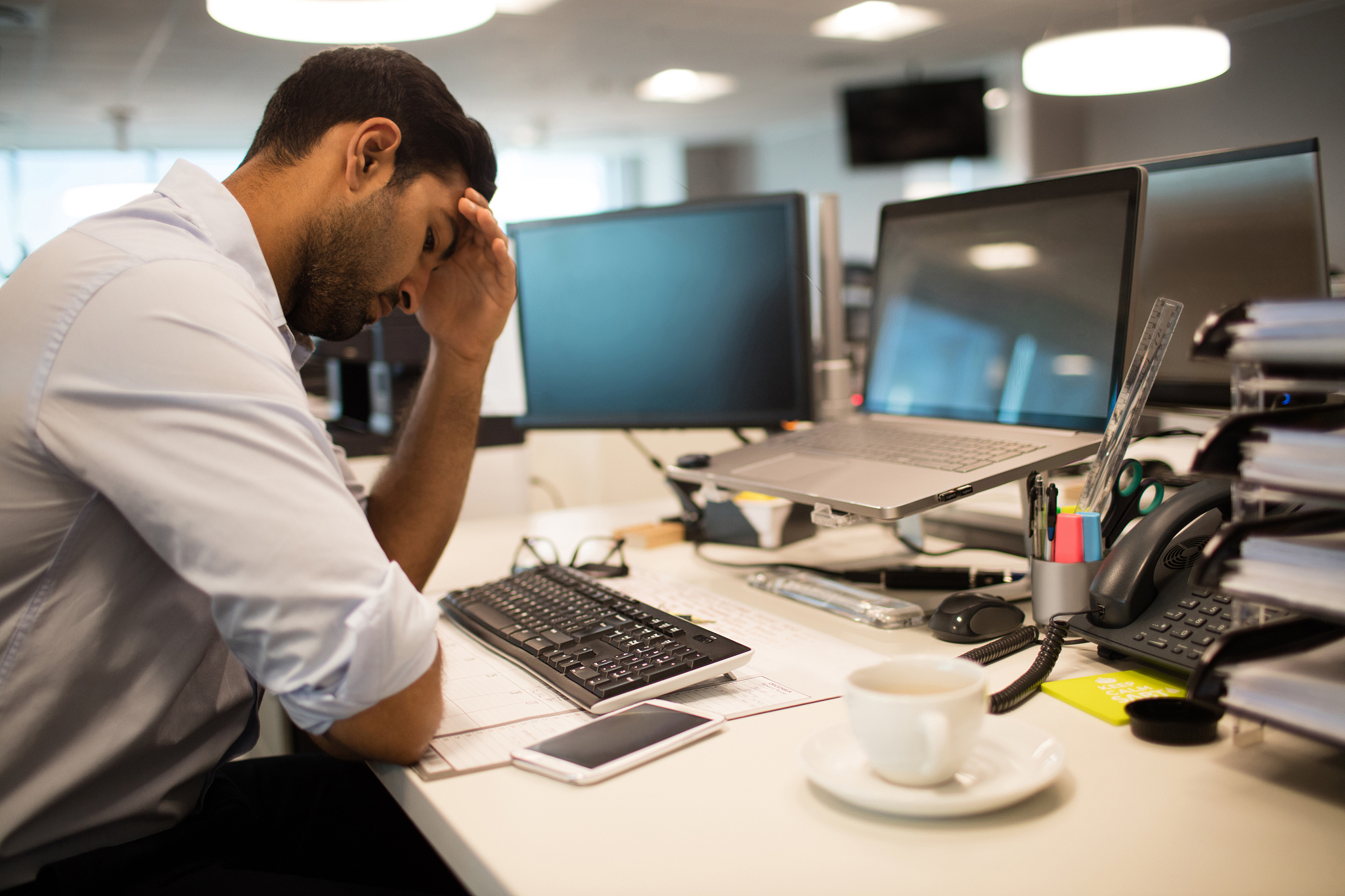 restless businessman sitting in office