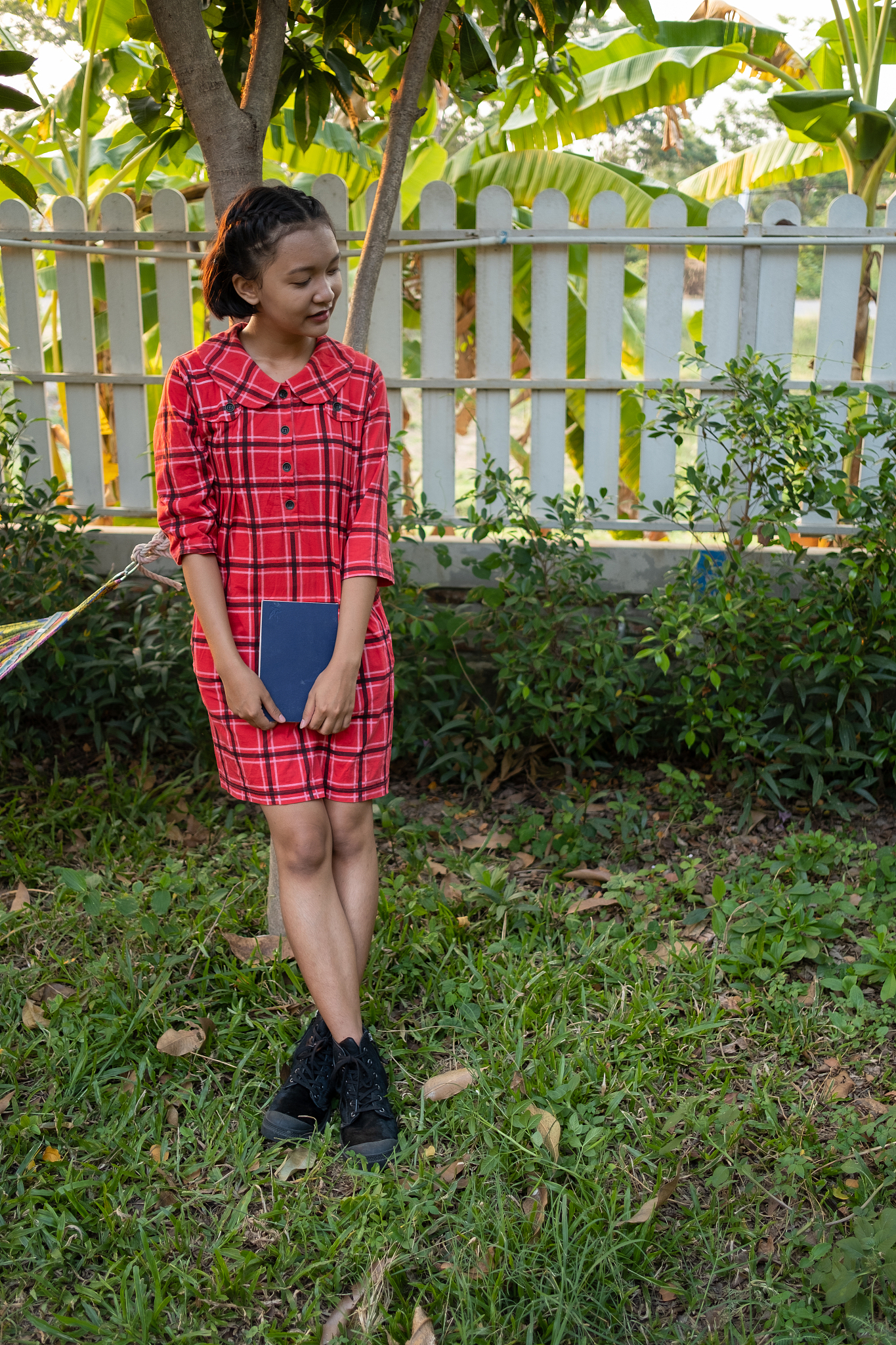 happy young asian girl spend time in the garden at home.