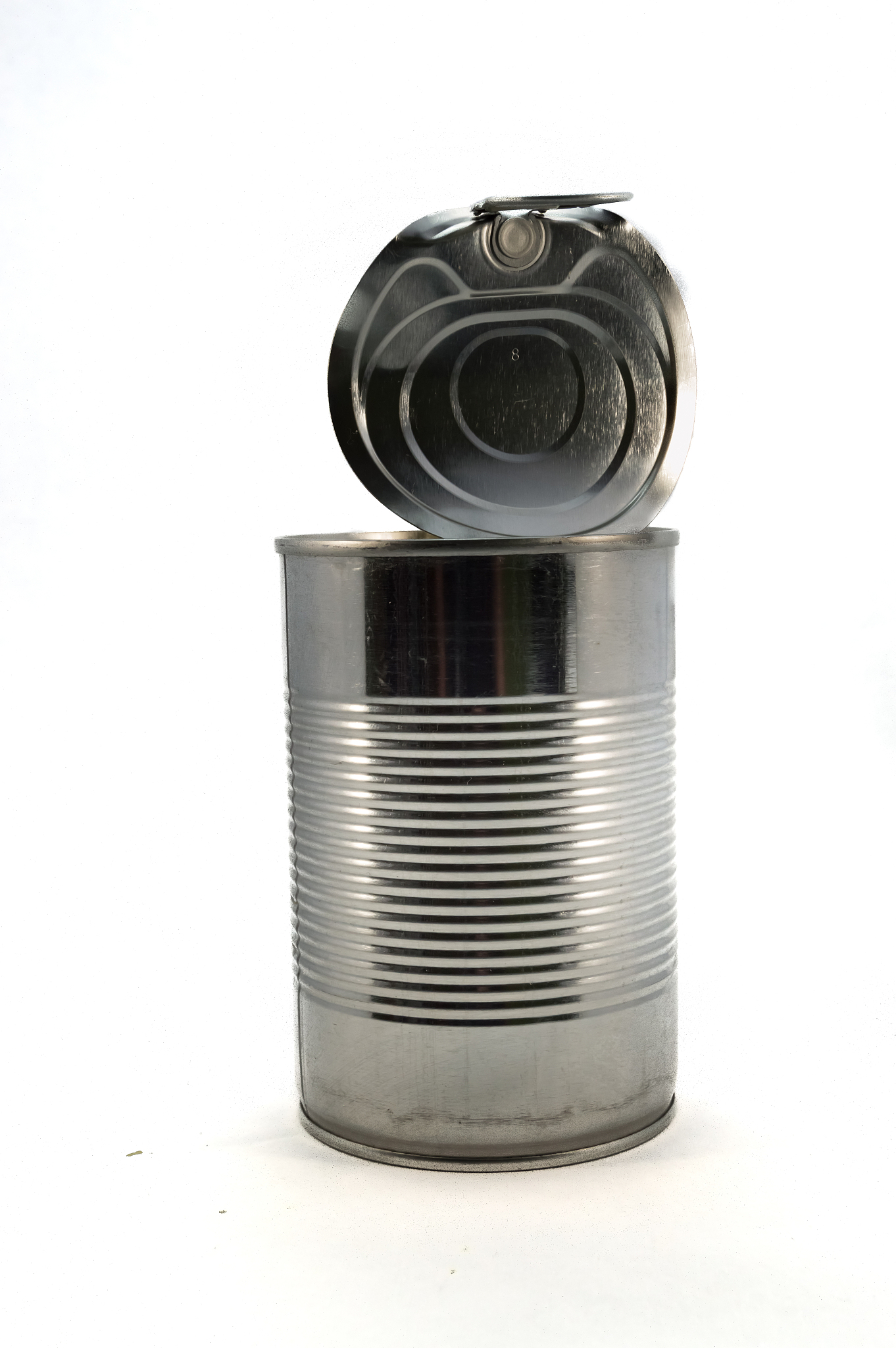 close-up of metallic can against white background