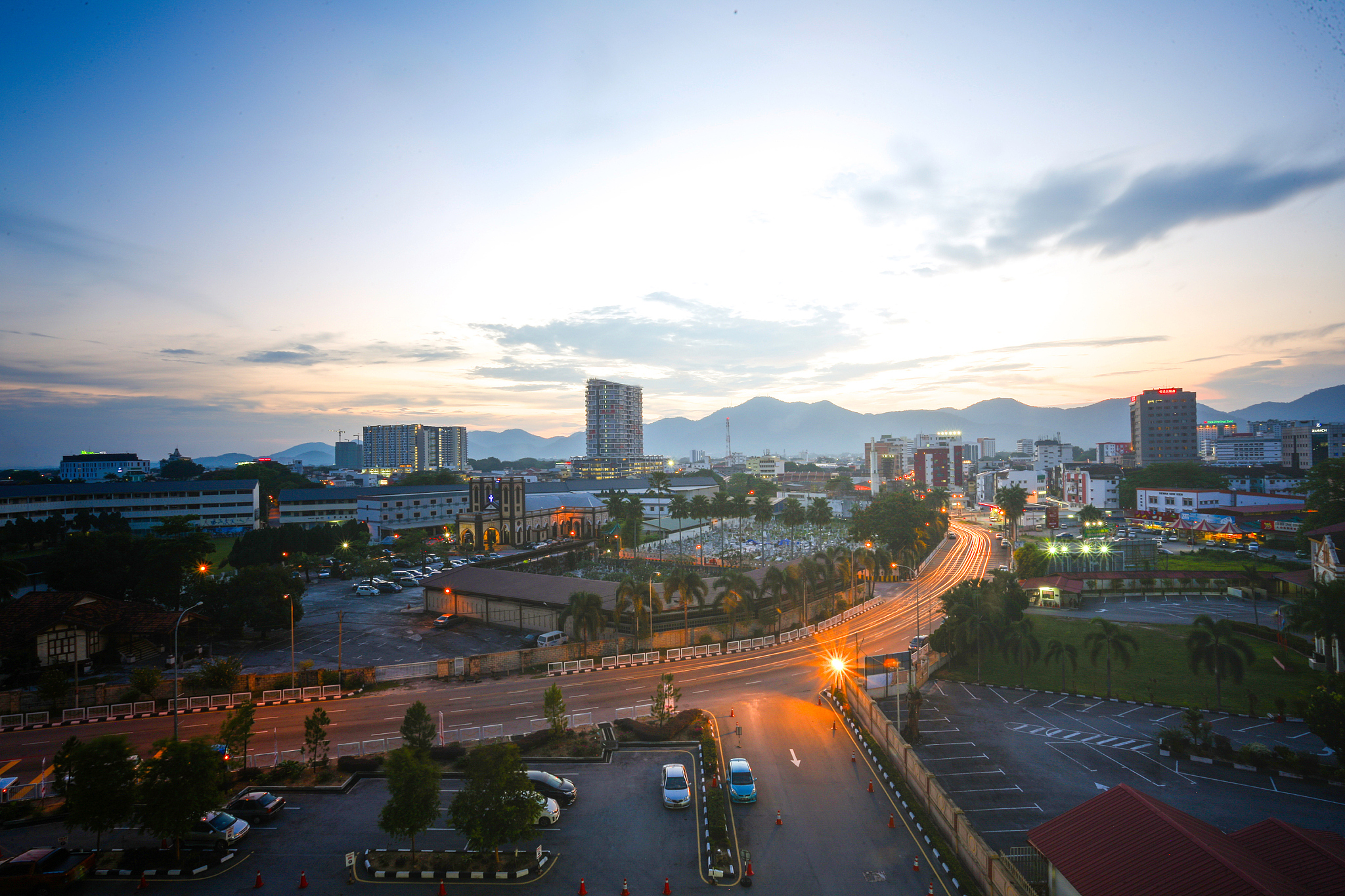 high angle view of illuminated city against sky during sunset