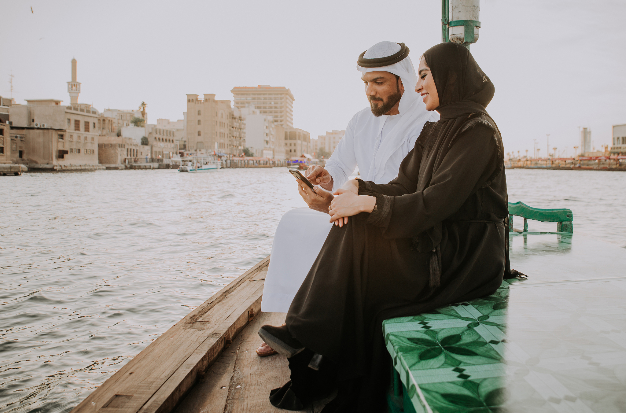 happy couple spending time in dubai. man and woman wearing tradi