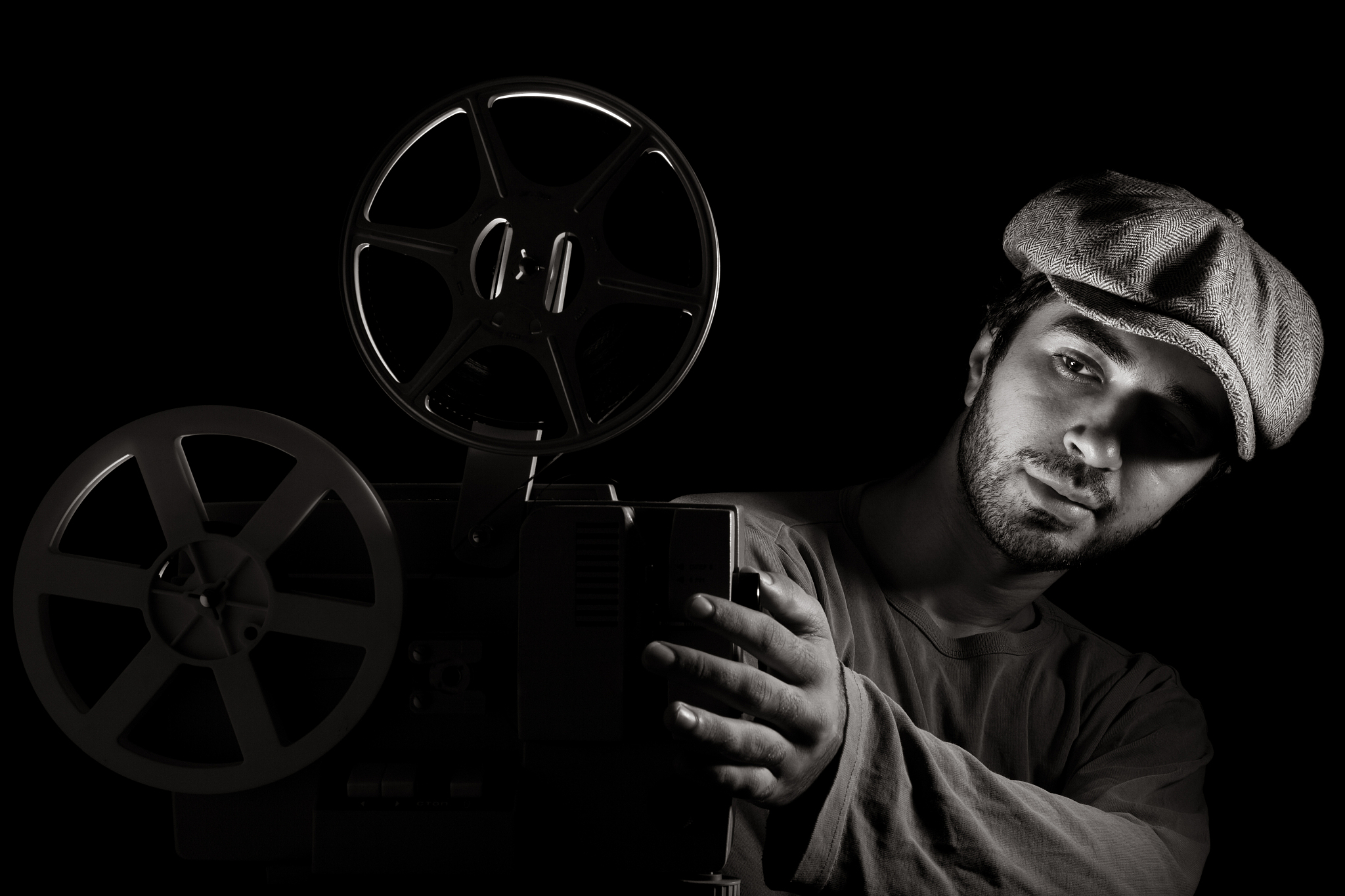 black and white portrait of old fashioned cinema projectionist