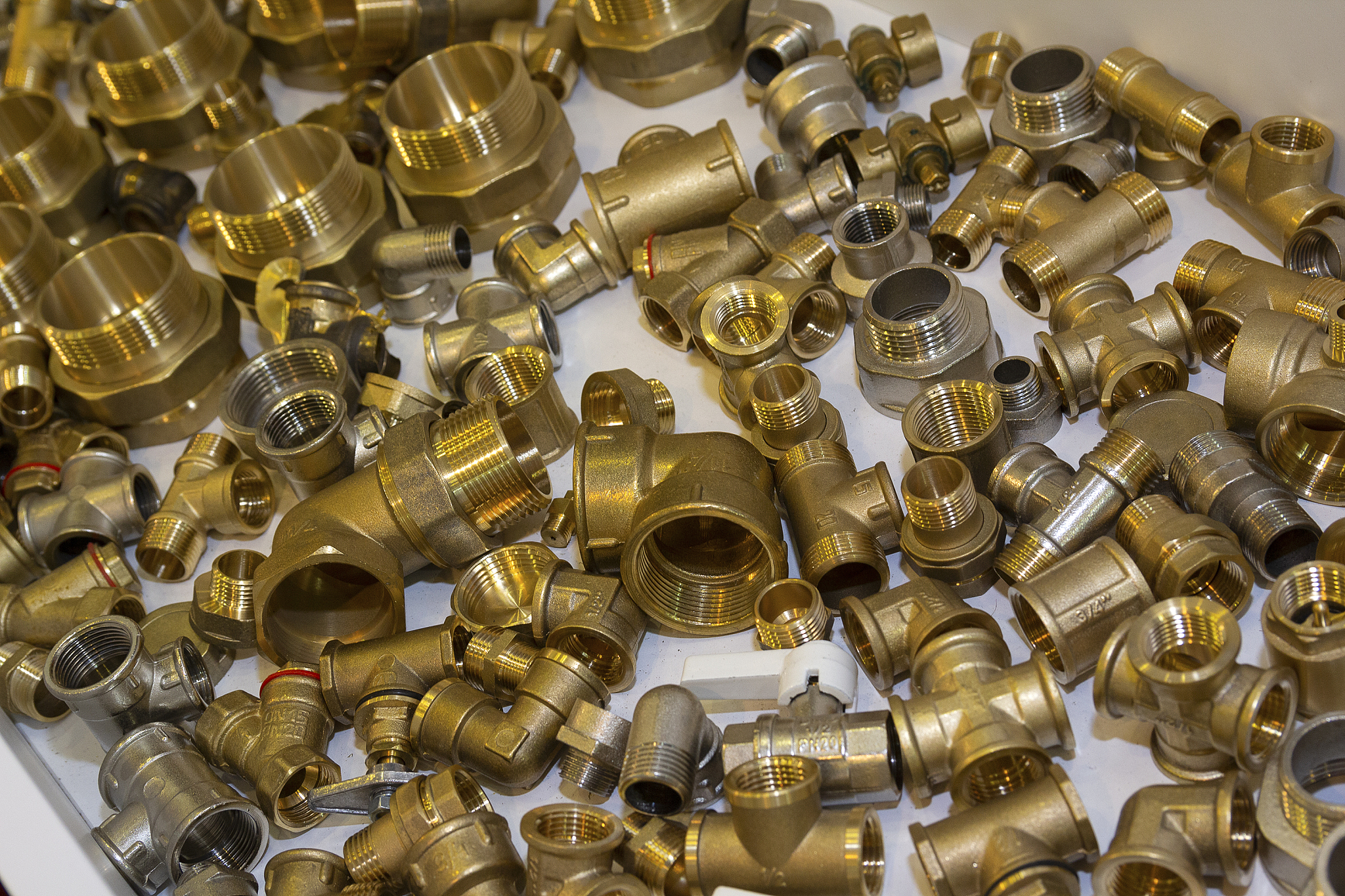 scattering of various brass sanitary products. industrial