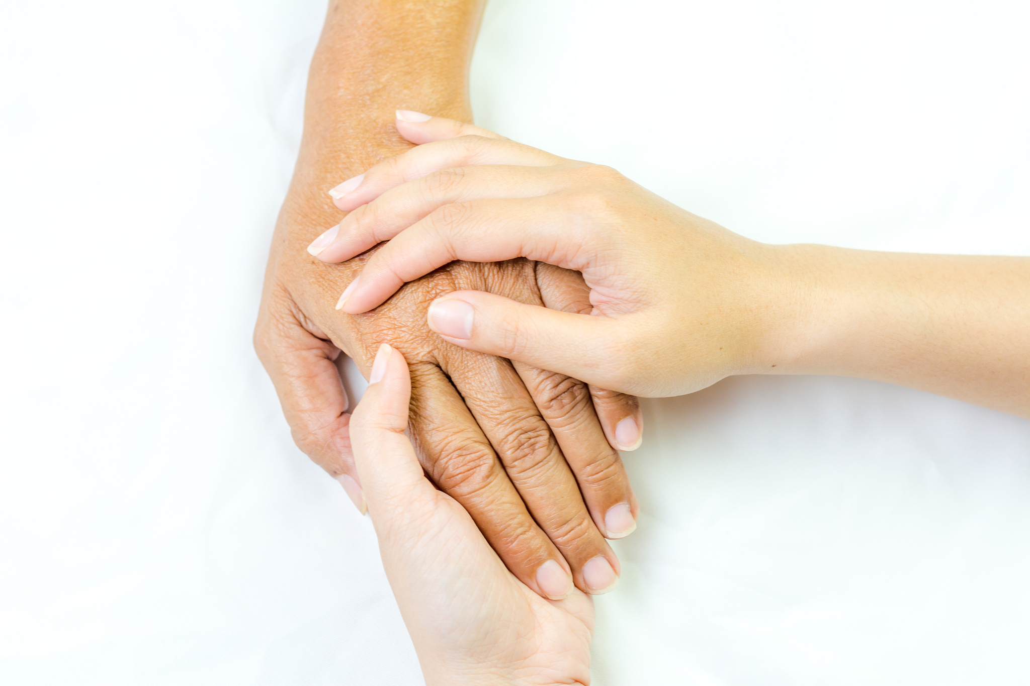 asian senior and asian young holding hands.