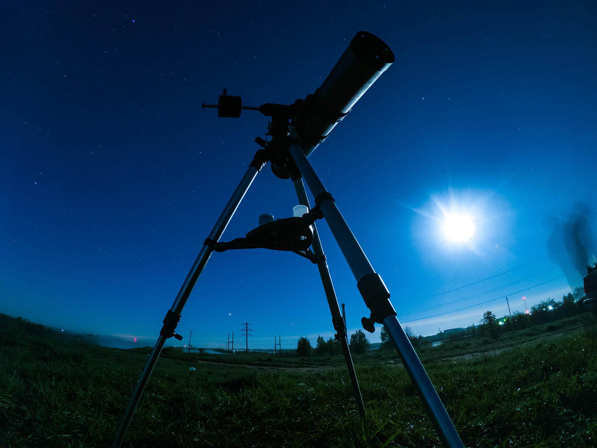 telescope on a tripod at night in nature against the backdrop of
