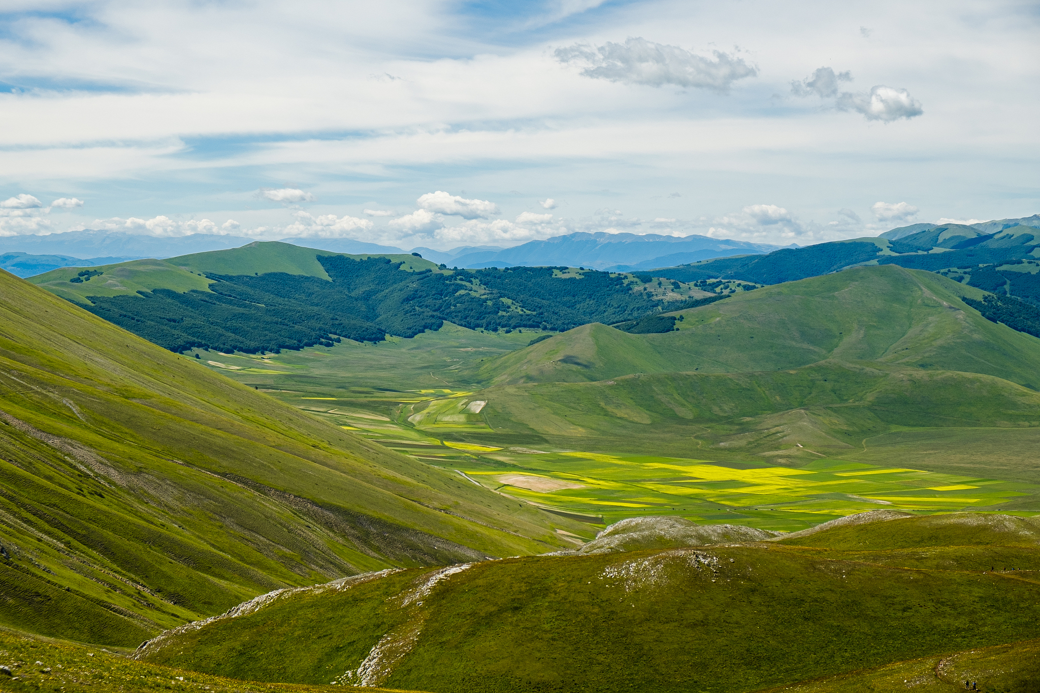 scenic view of landscape against sky in castelluccio, umbria