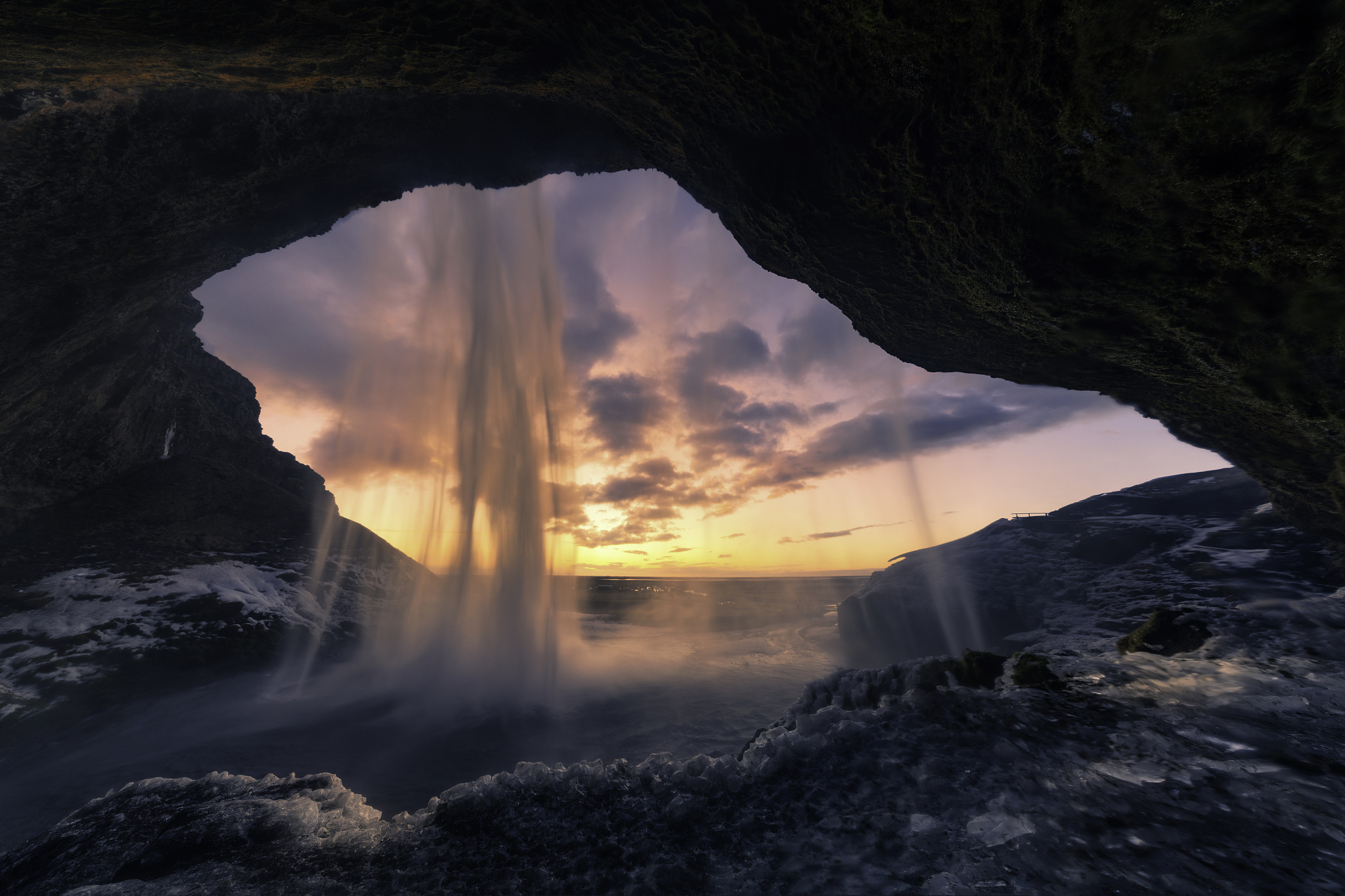 behind of seljalandsfoss waterfall at the sunset, iceland