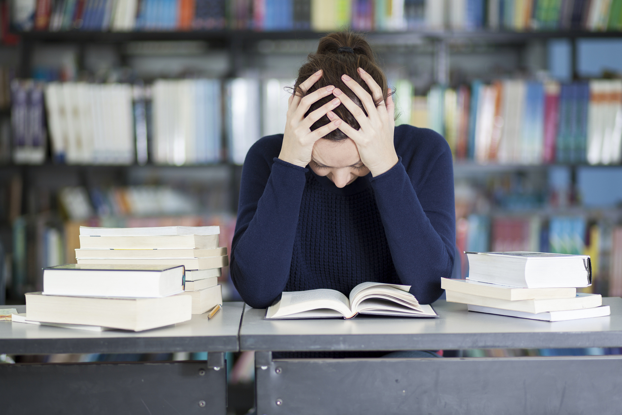 female student overwhelmed with homework