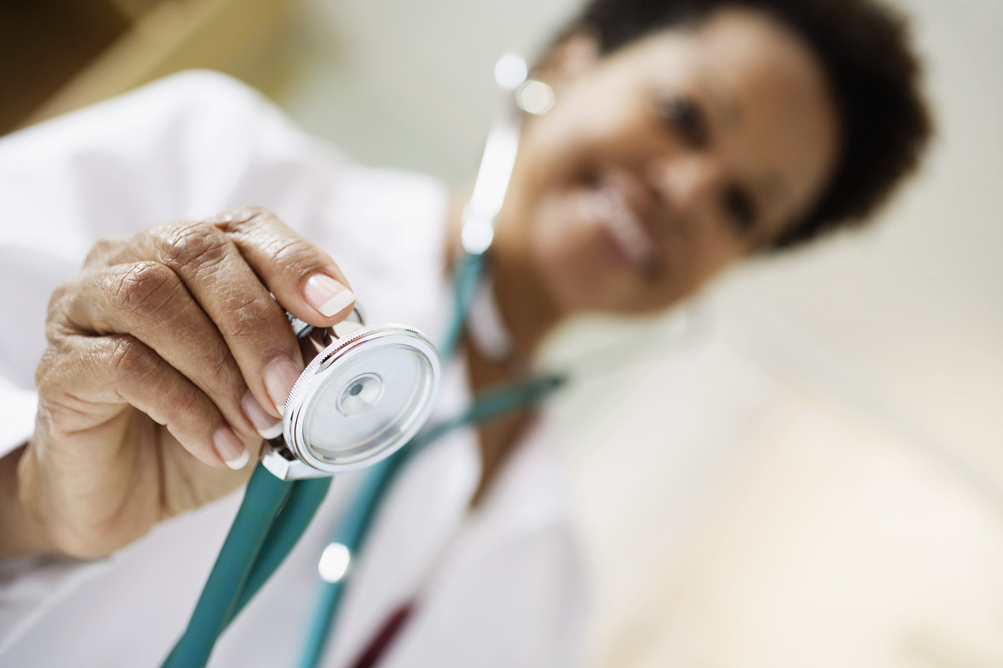 doctor holding out stethoscope