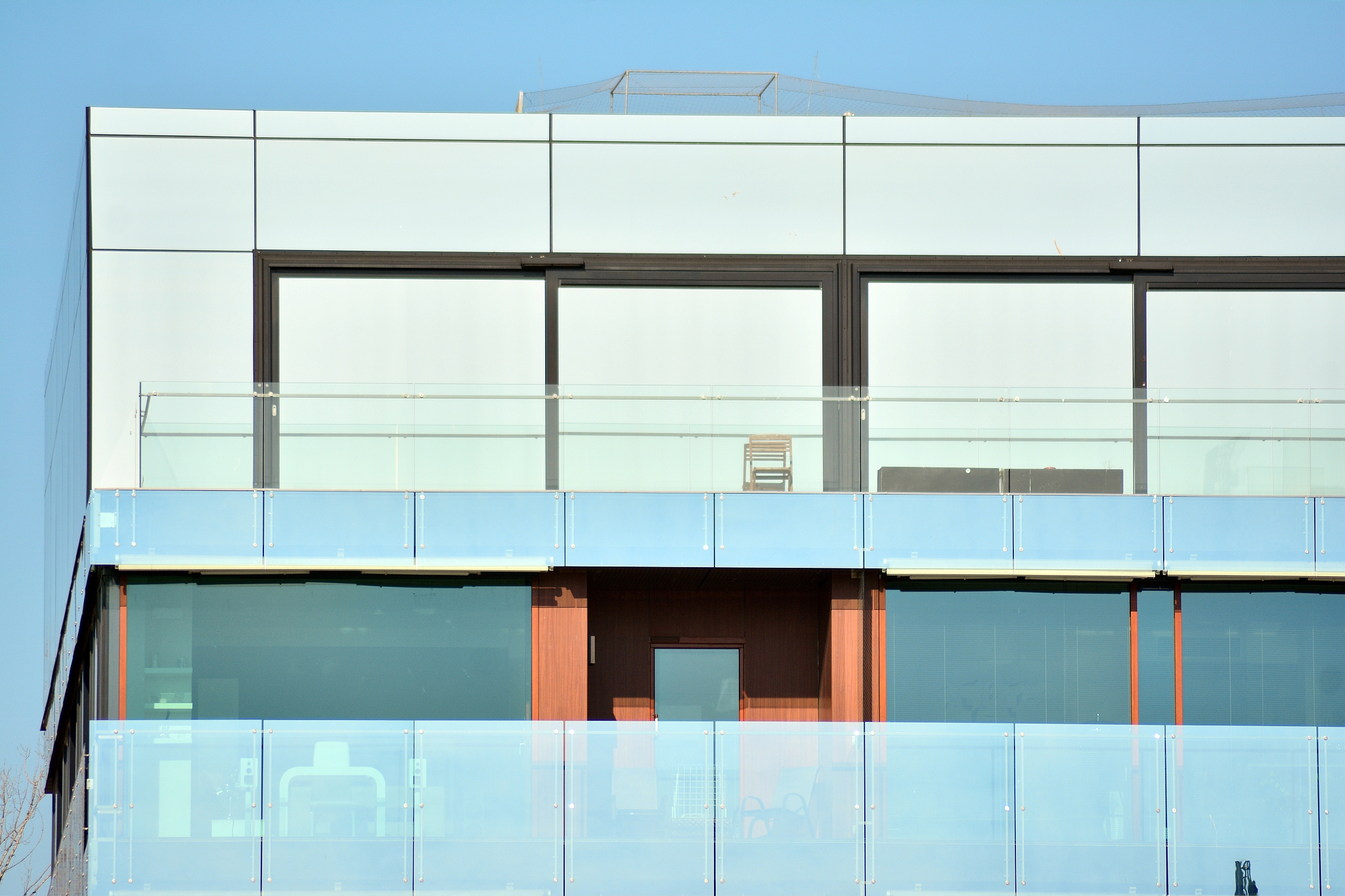 modern apartment buildings on a sunny day with a blue sky.