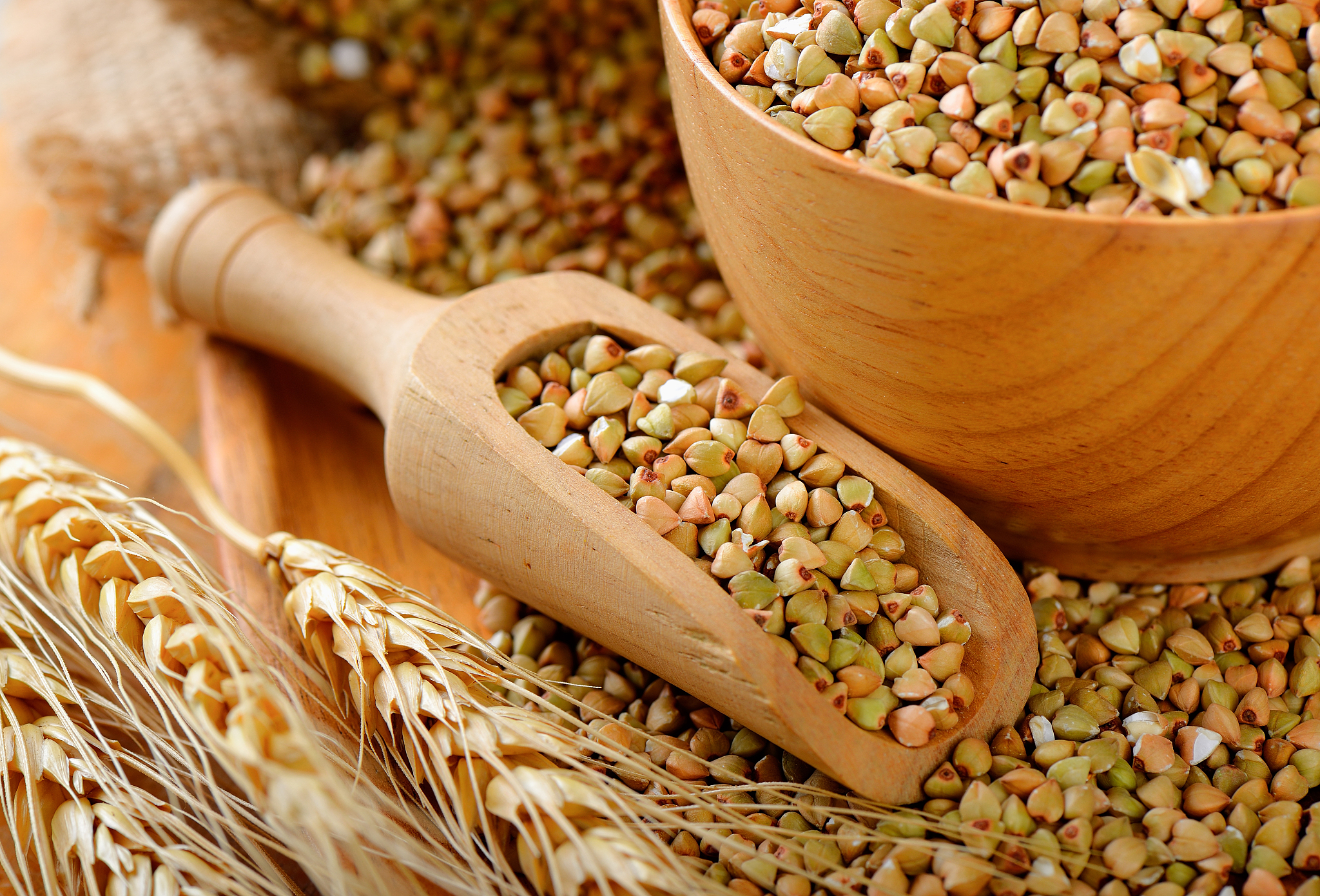 buckwheat in wood scoop on table