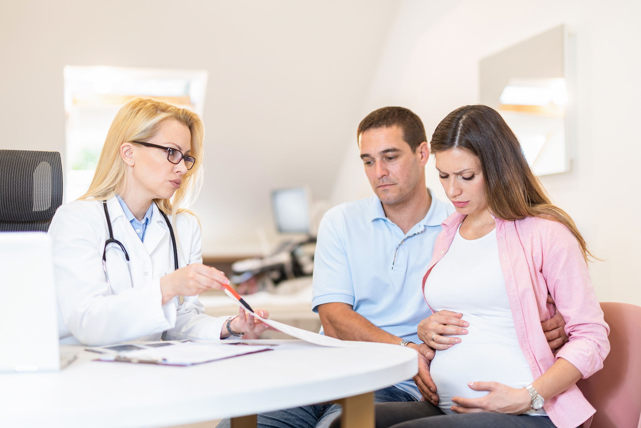 worried young couple on a pregnancy exam expecting a baby.
