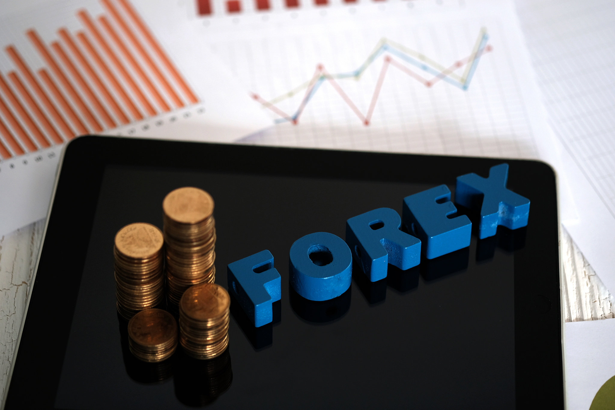 forex text and stack of coin with tablet computer and financial 