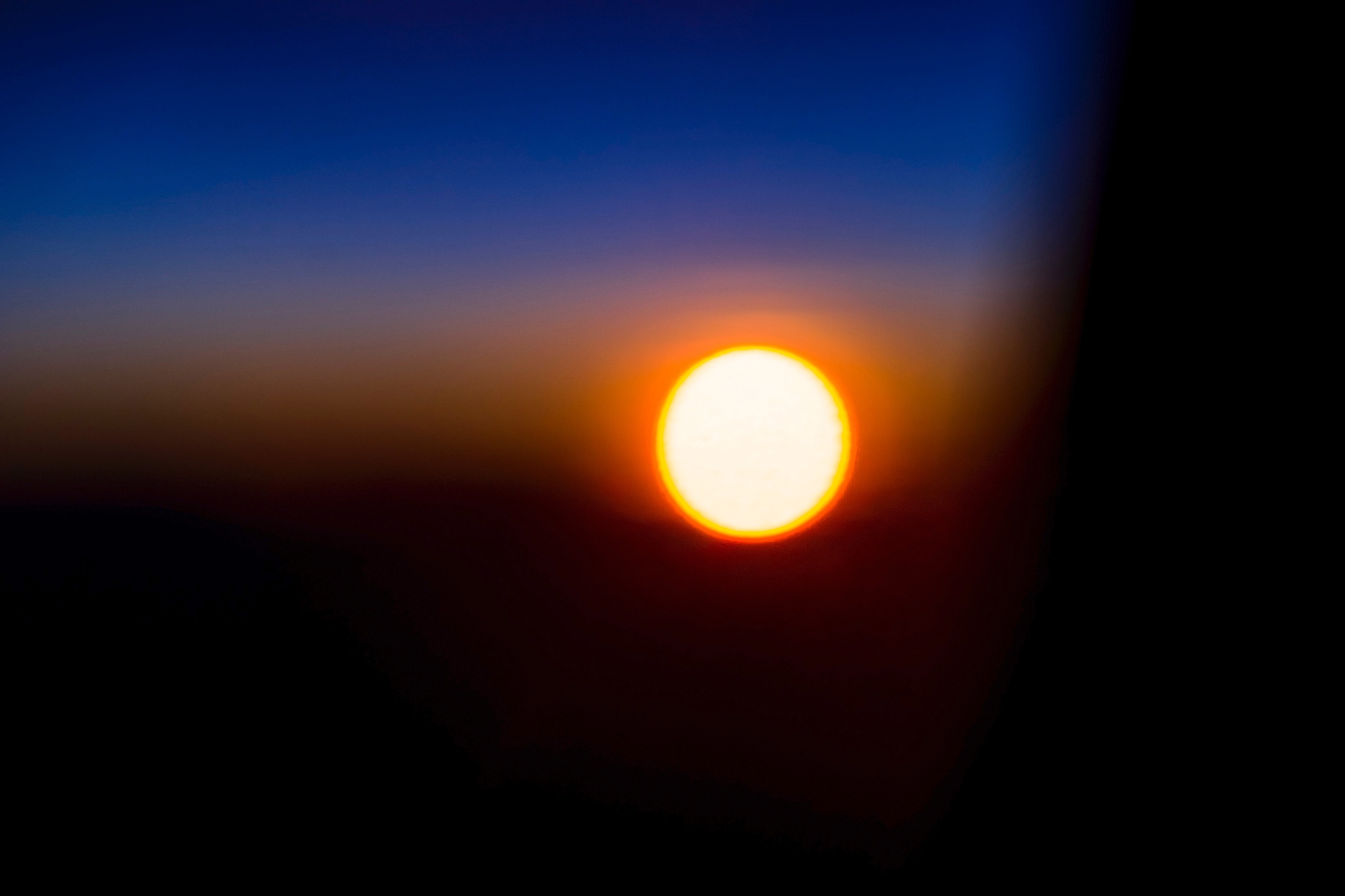sunset taken from inside the plane.