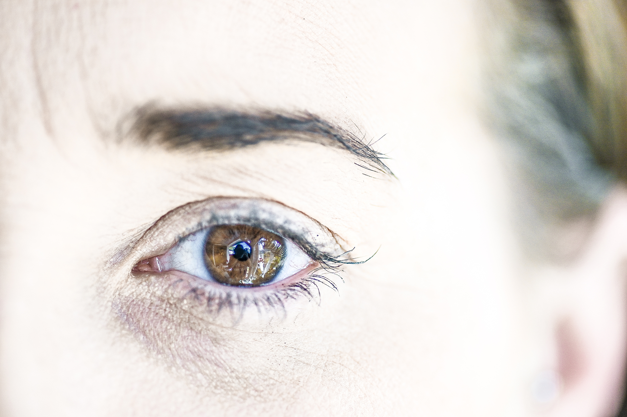 extreme close up eyes of a brown eyed woman