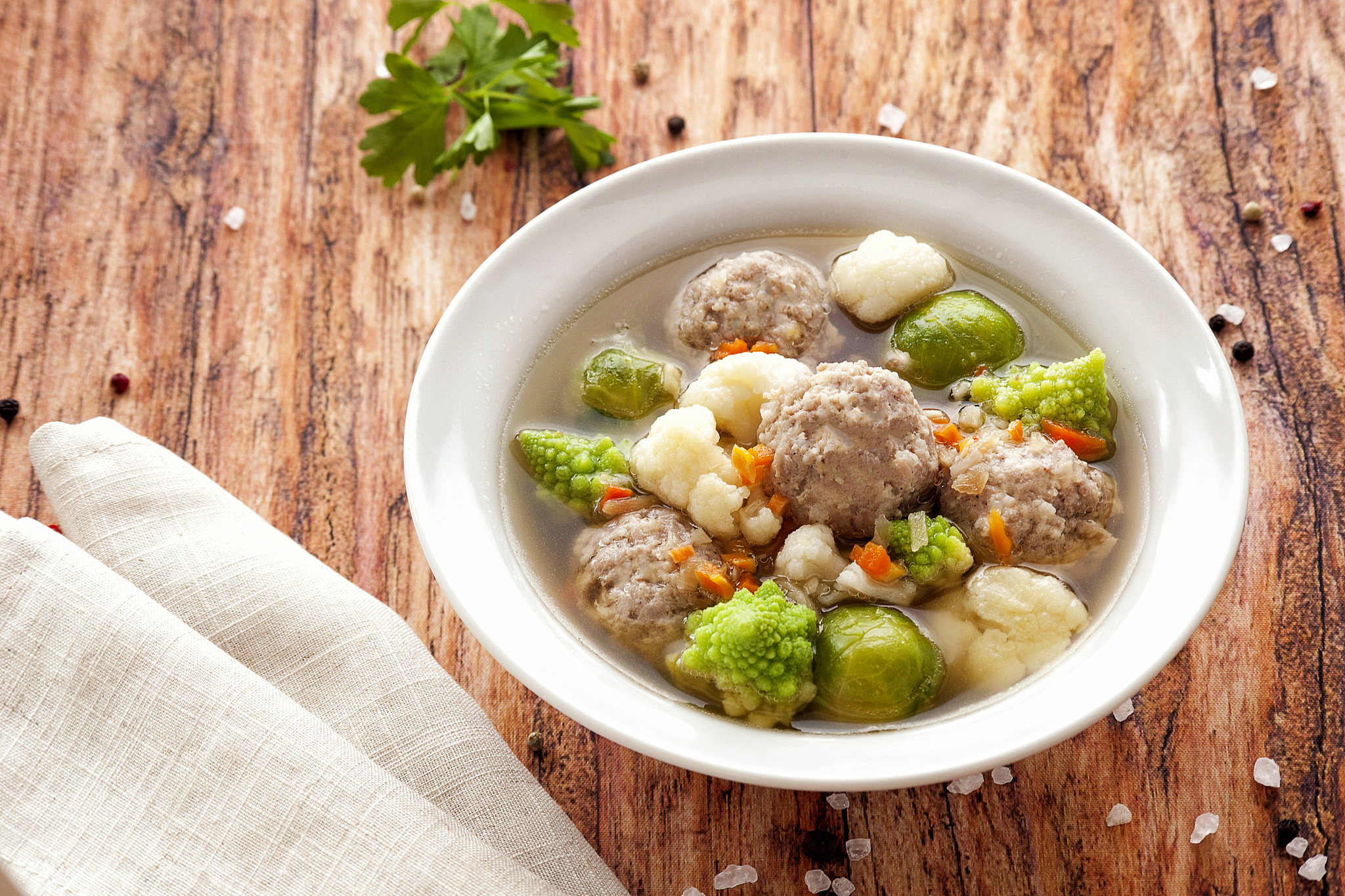 hot thick soup with meatballs and cabbage mix.