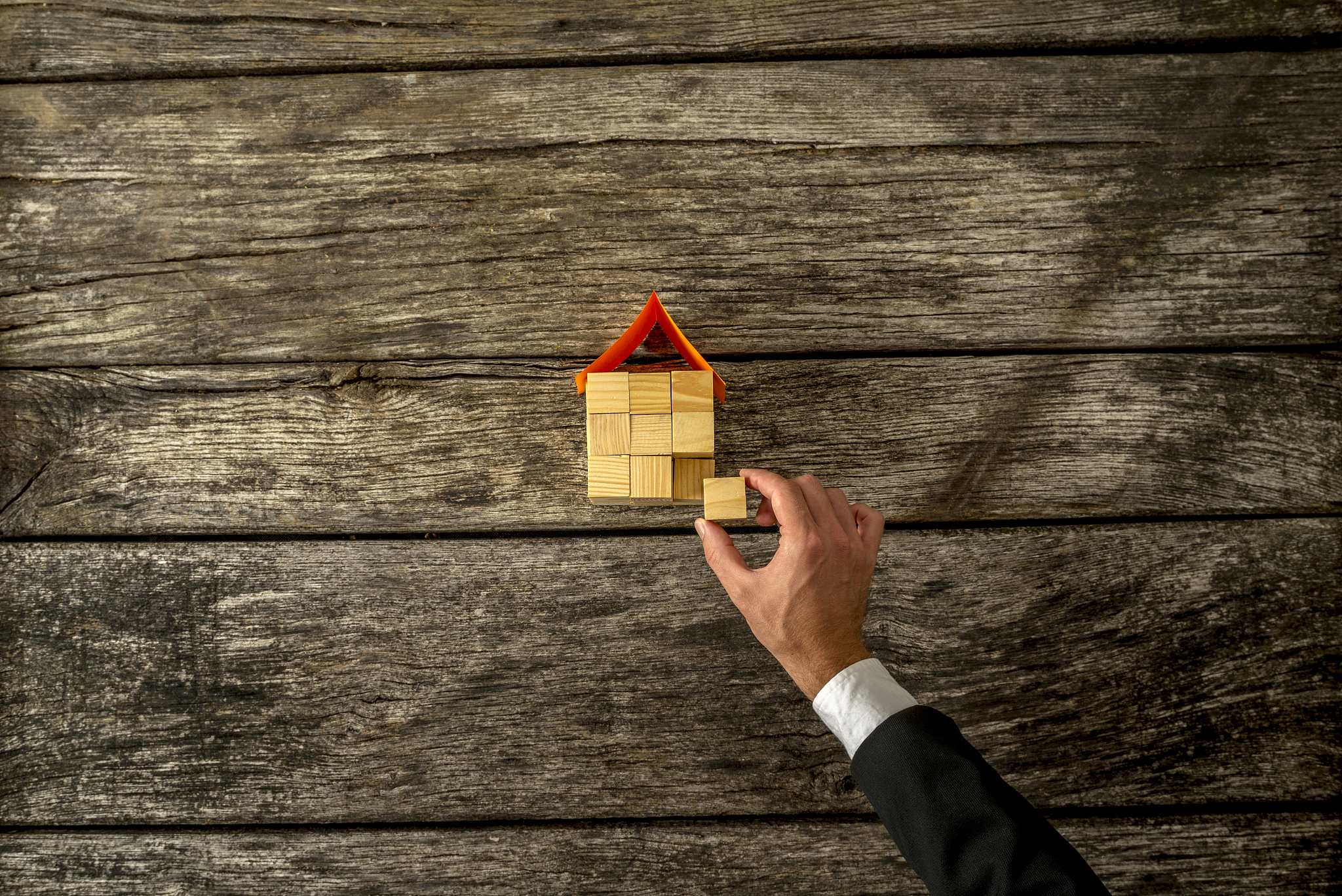 real estate or insurance agent constucting a house