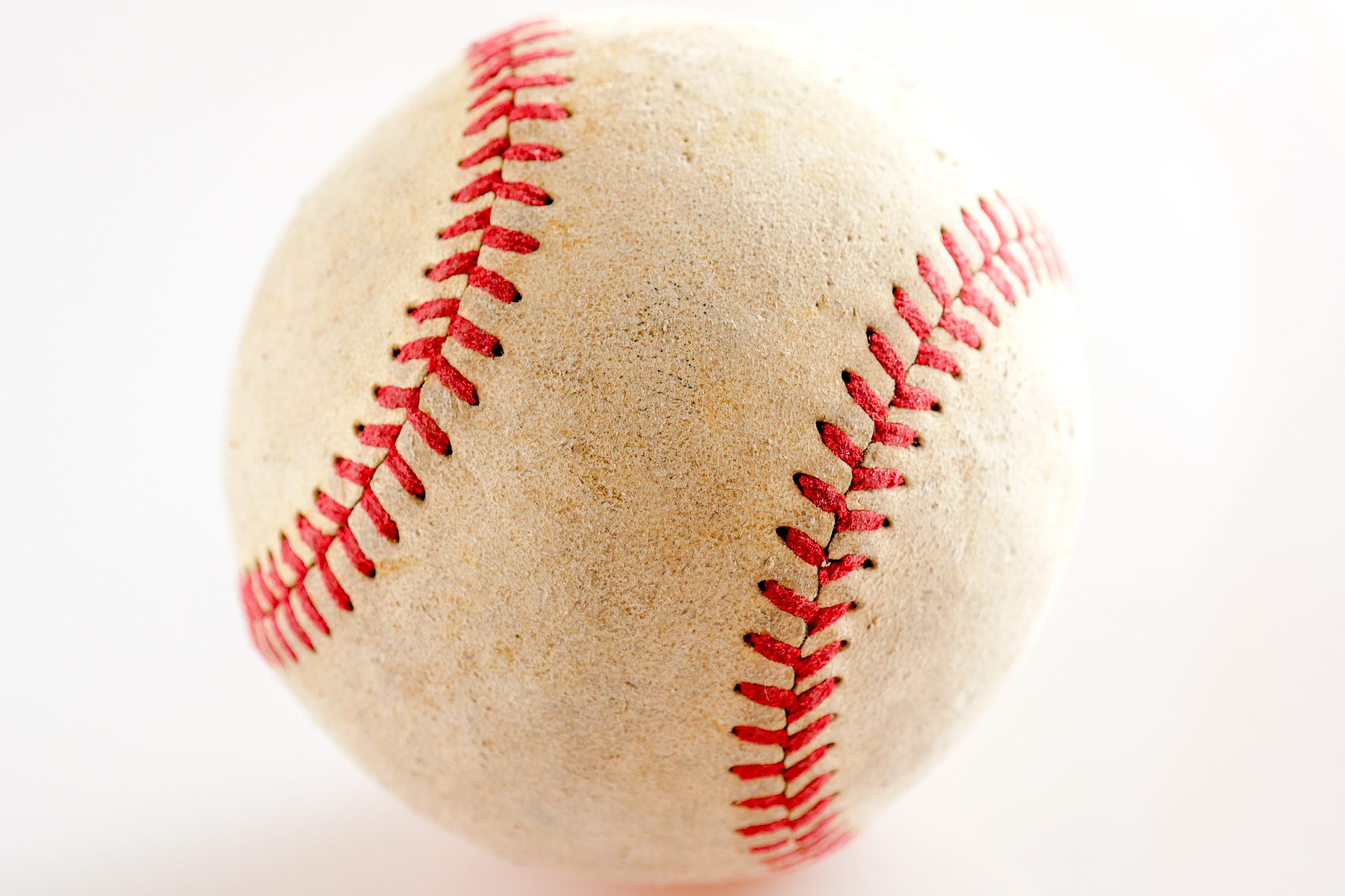 sports equipment old baseball on white background