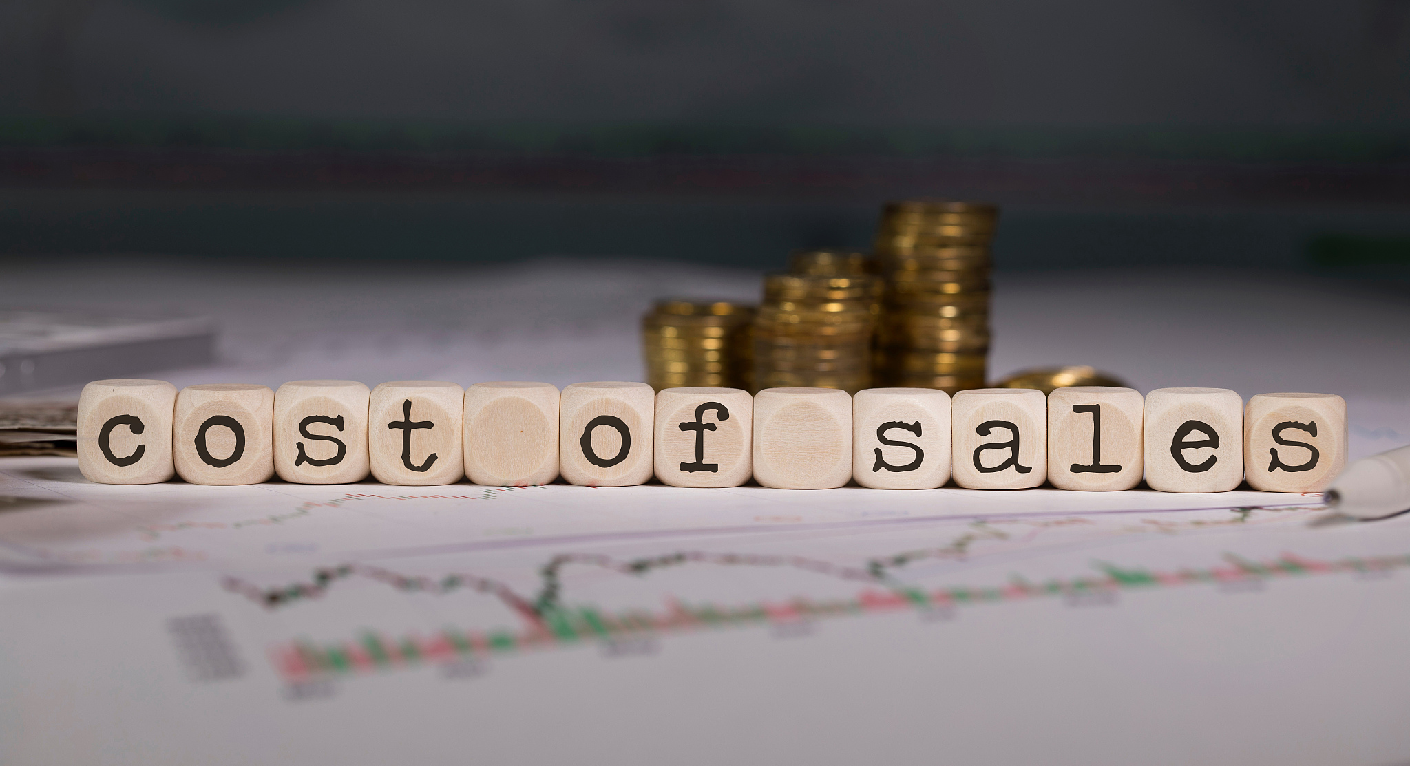 term cost of sales composed of wooden letters.