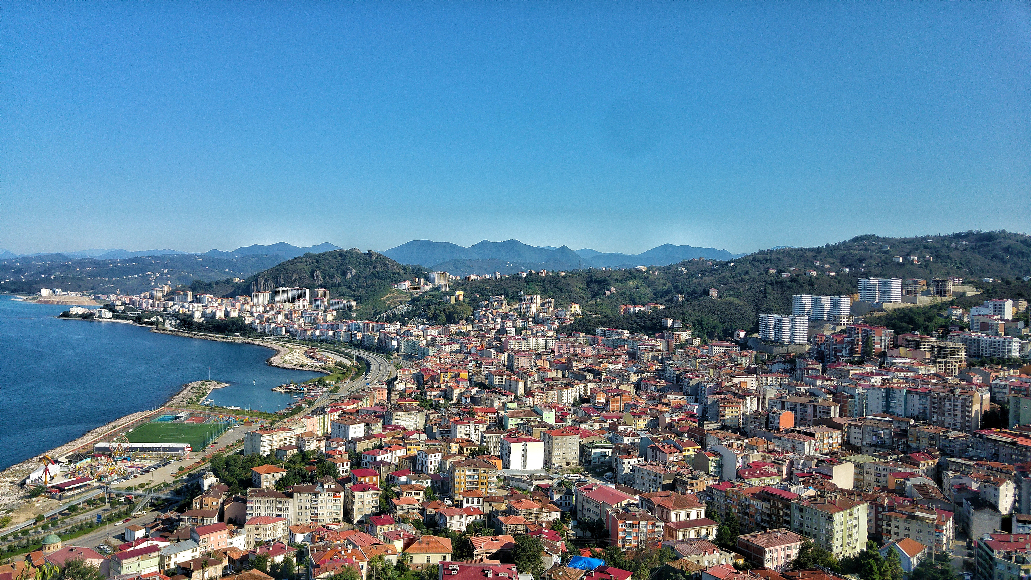high angle view of cityscape against clear blue sky
