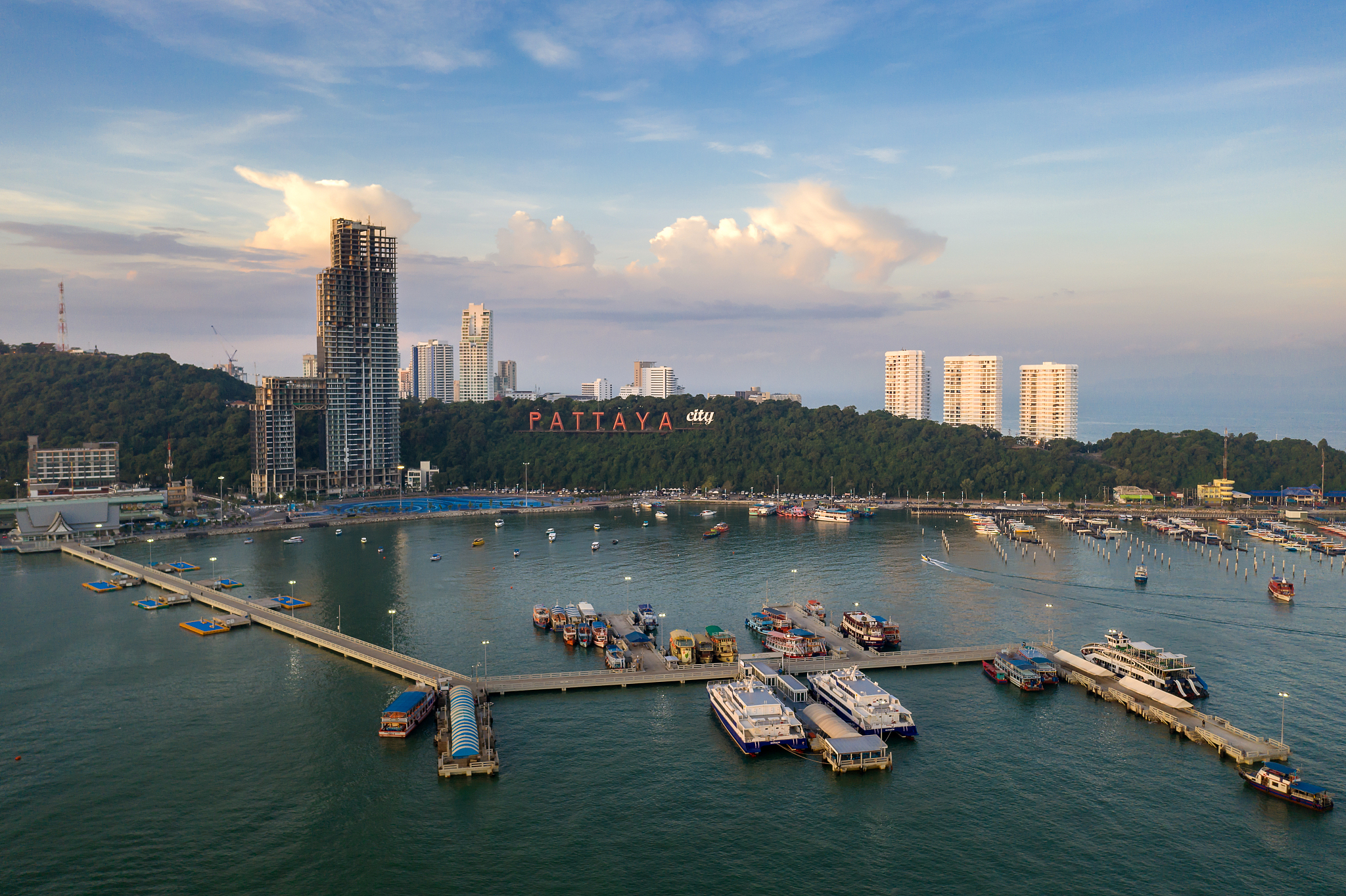 panoramic aerial view of pattaya city with boat during sunrise i