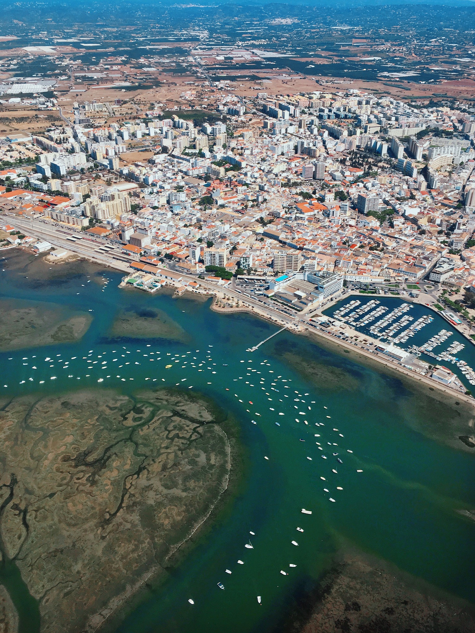 high angle view of sea and buildings in city