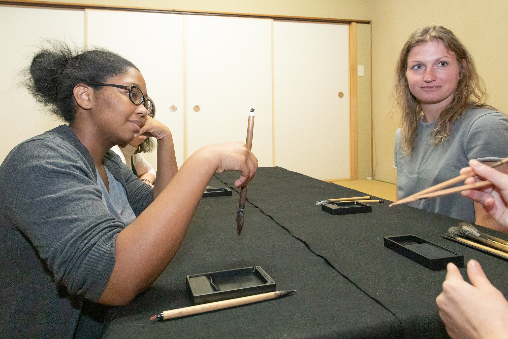 foreign people learning japanese calligraphy