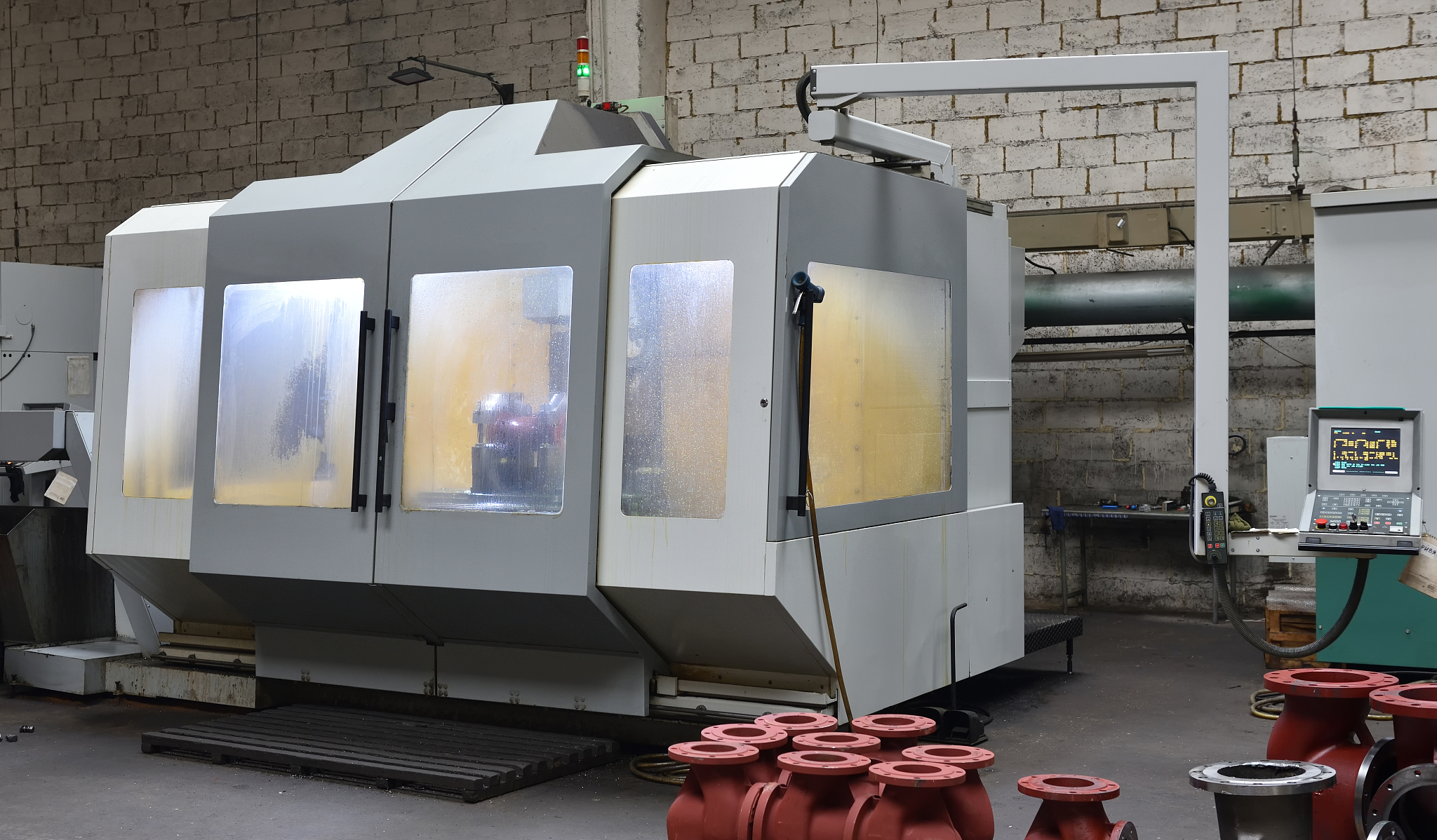 cnc machine for working with metal, slightly dirty, is in the fa